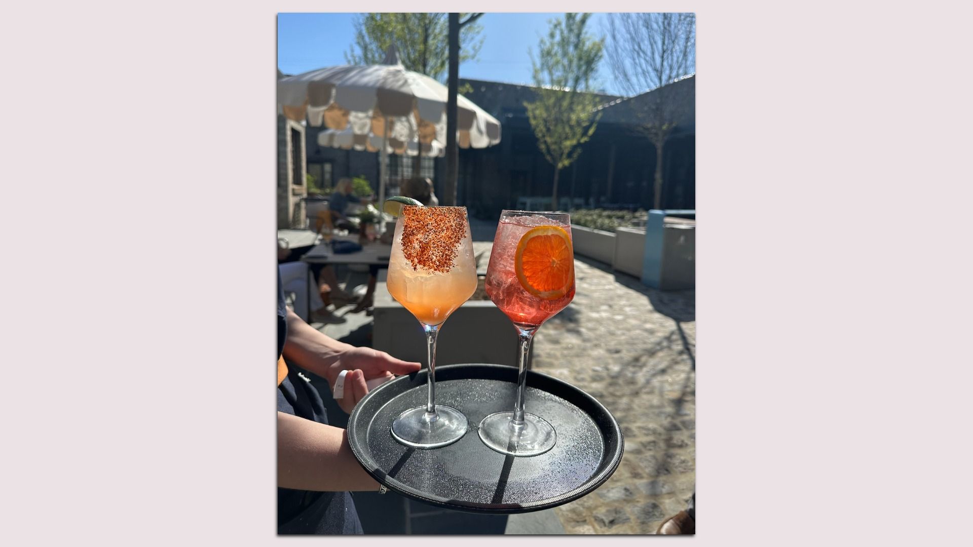 2 cocktails on a tray 