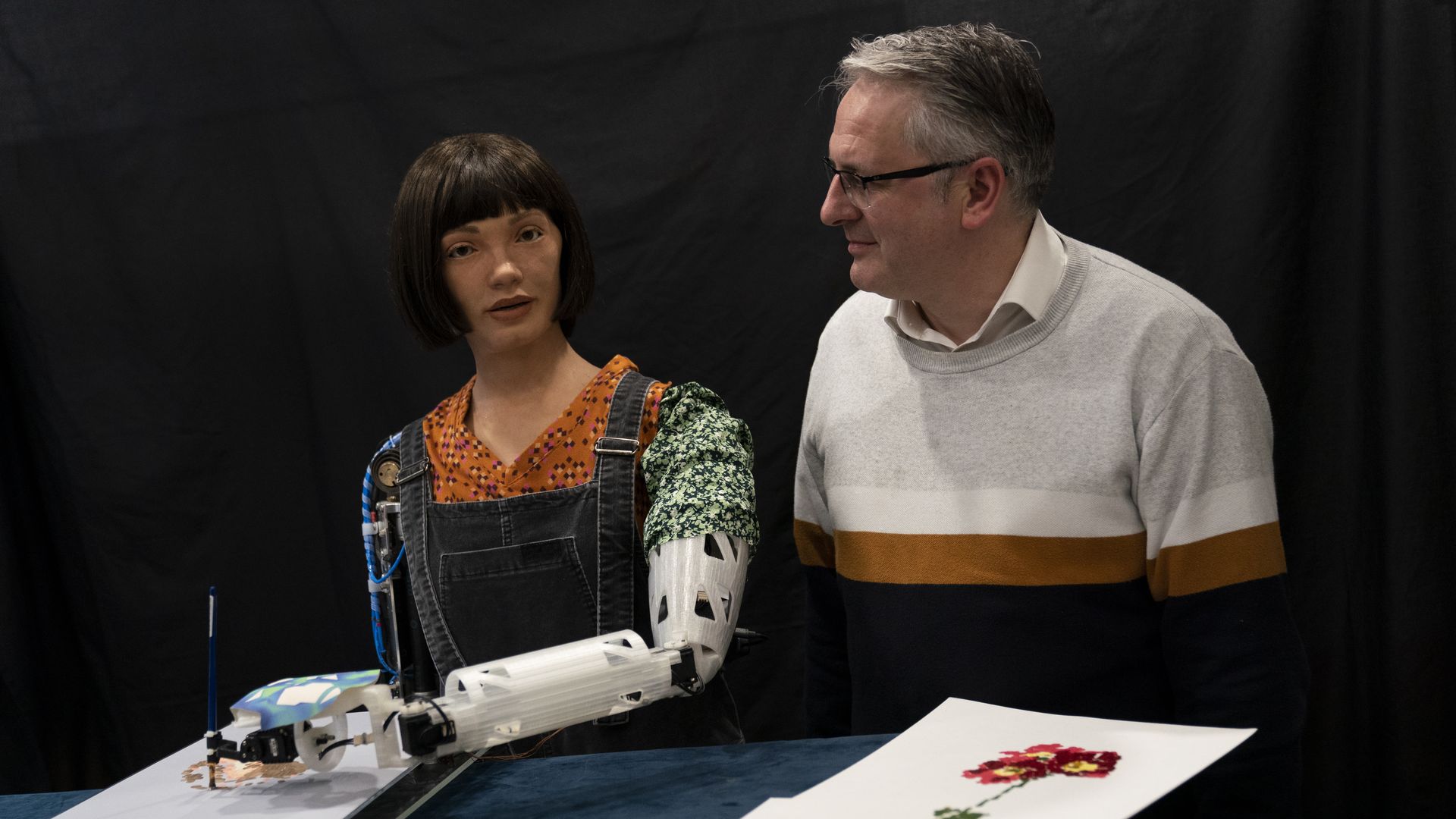 A robotic artist named Ai-Da and her human creator.