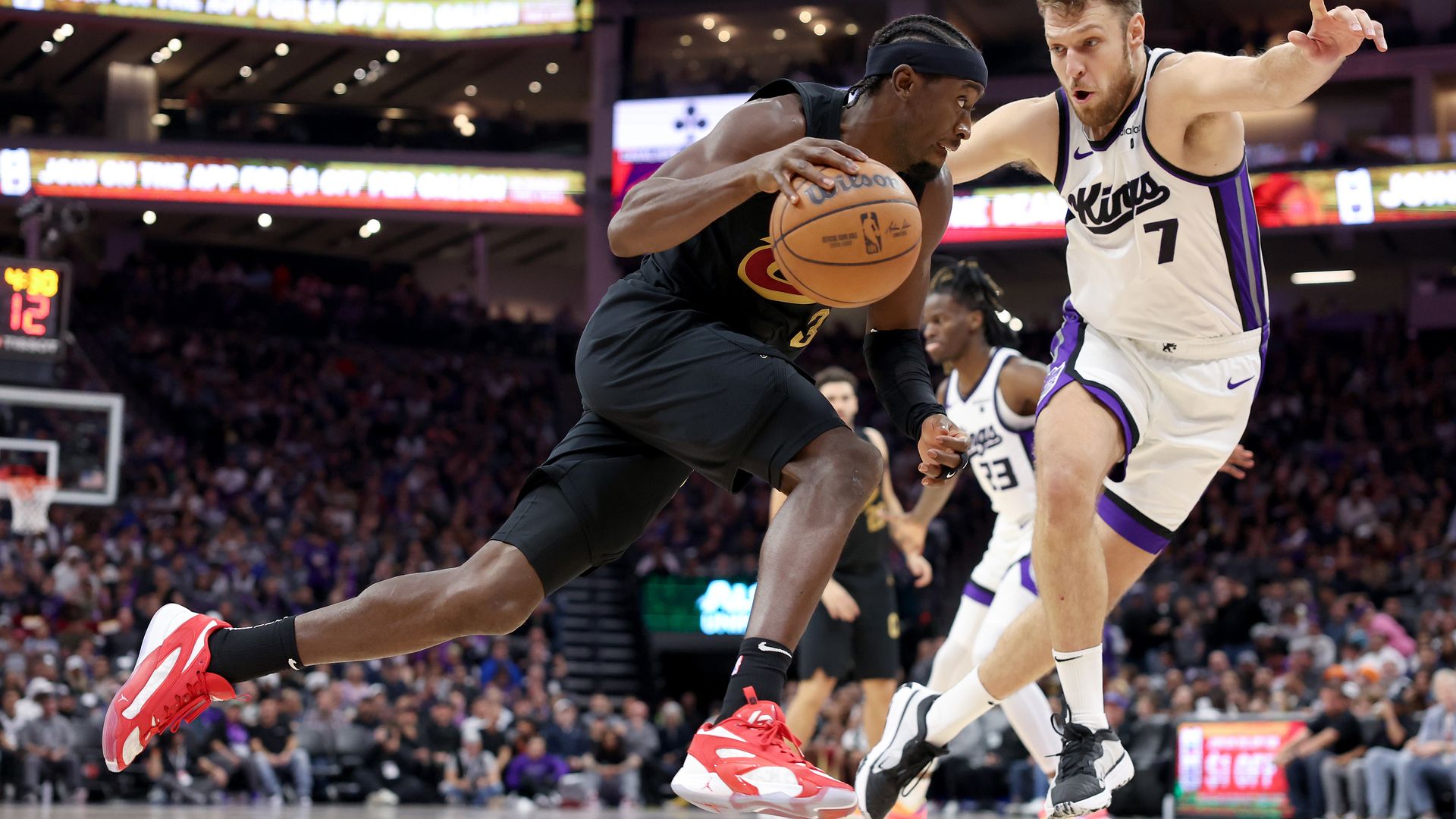 The Cavs Caris LeVert drives on the Kings Sasha Vezenkov