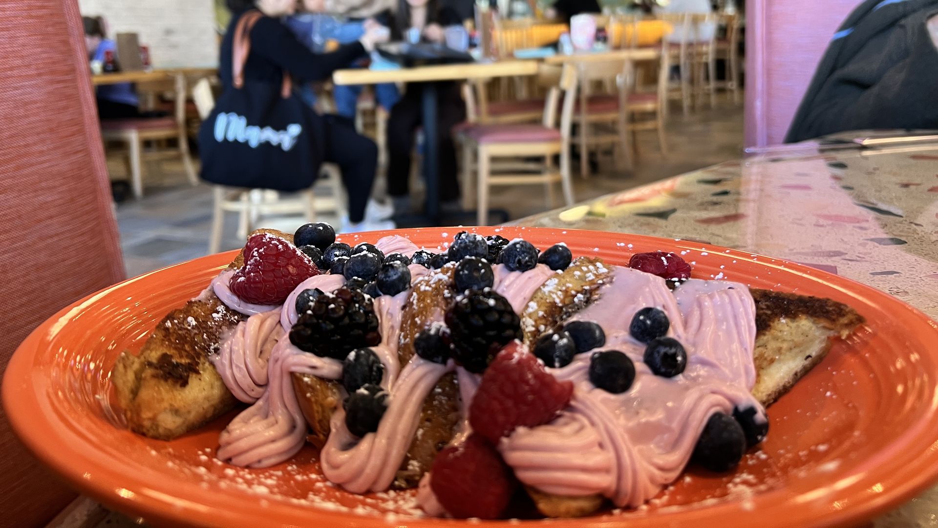 Photo of toast with pink cream and berries 