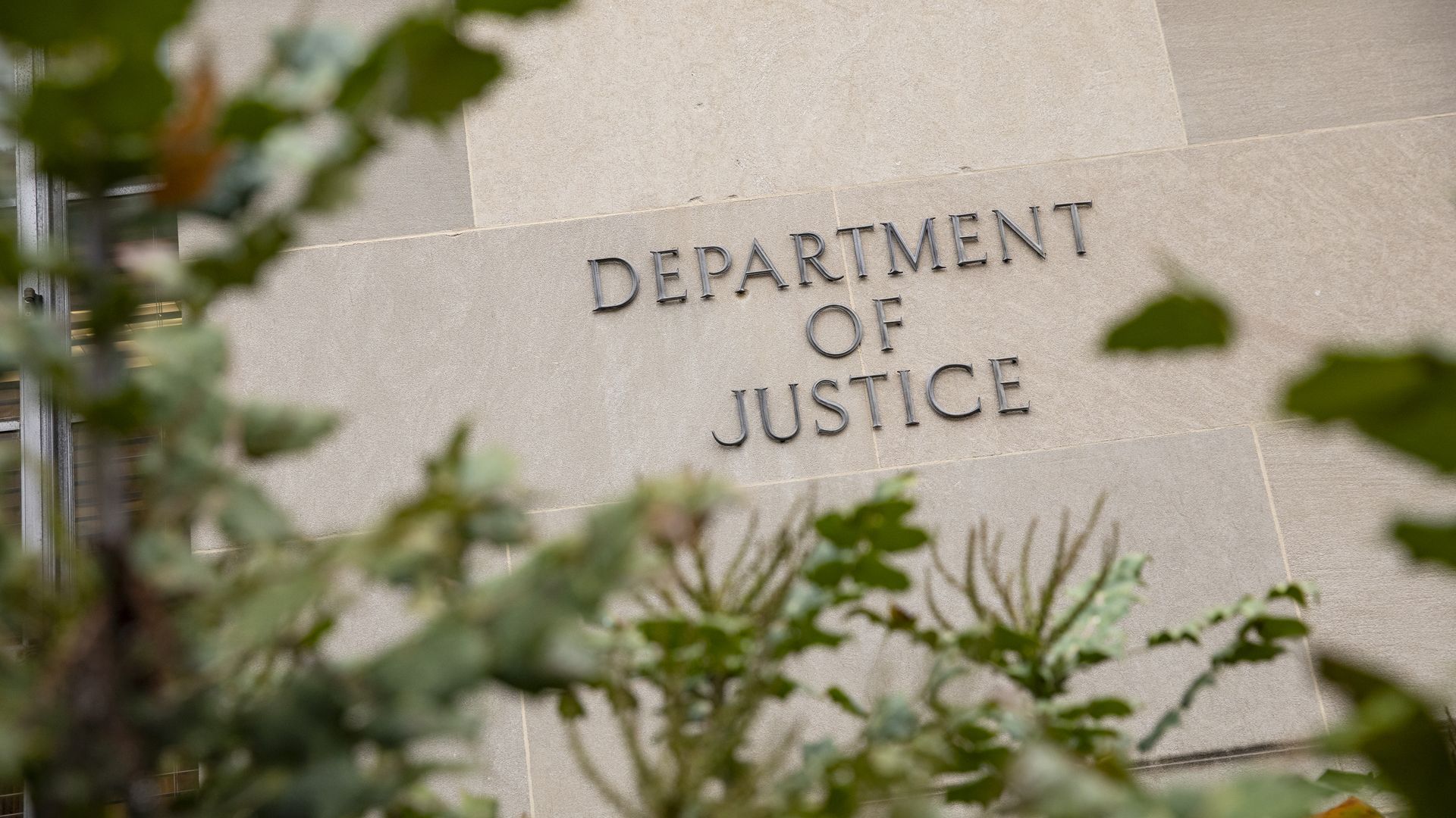 Photo of the exterior of the DOJ building, which has "Department of Justice" displayed