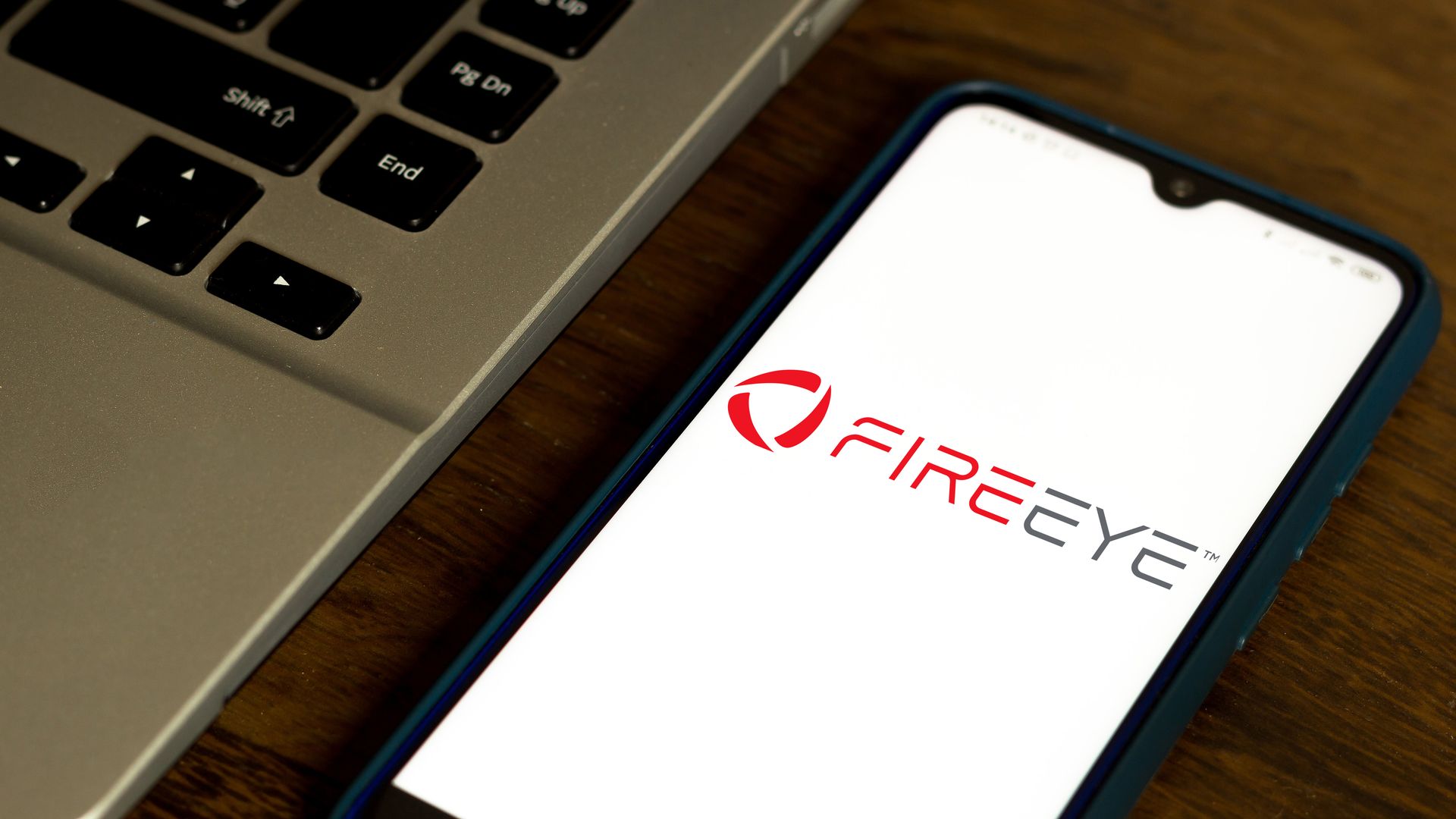 The FireEye logo on a cellphone screen.