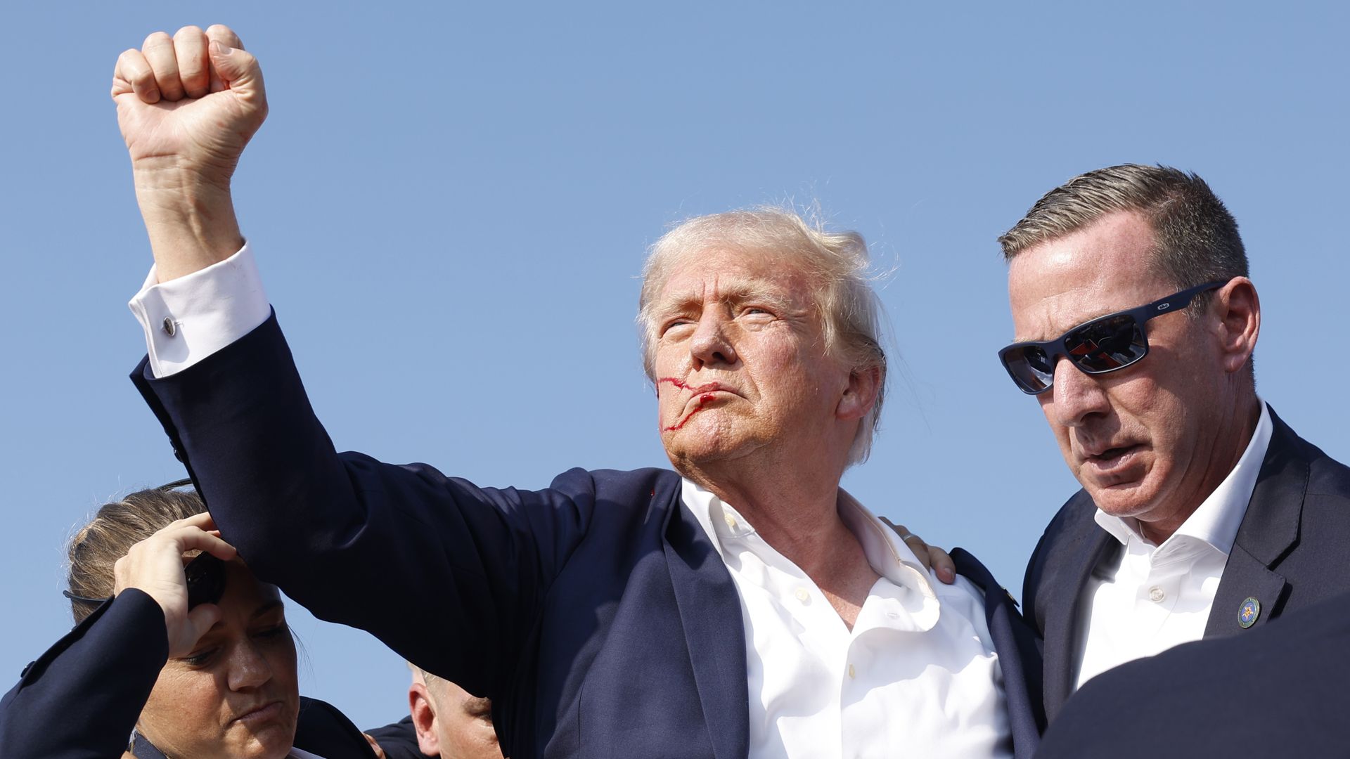 Republican presidential candidate former President Donald Trump is rushed offstage during a rally on July 13, 2024 in Butler, Pennsylvania.