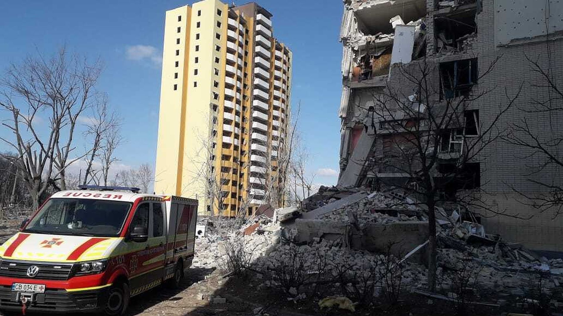 An ambulance stands ready by a damaged residential building after a Russian attack in Chernihiv, Ukraine on March 17.