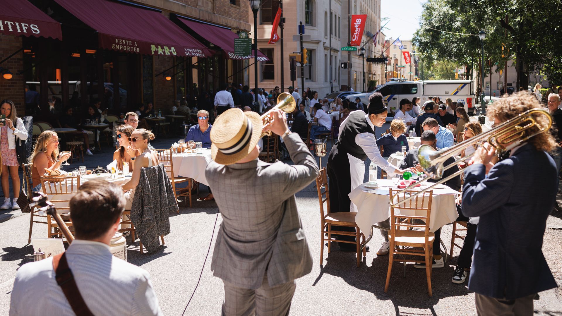 A band playing in front of outdoor diners in Philadelphia