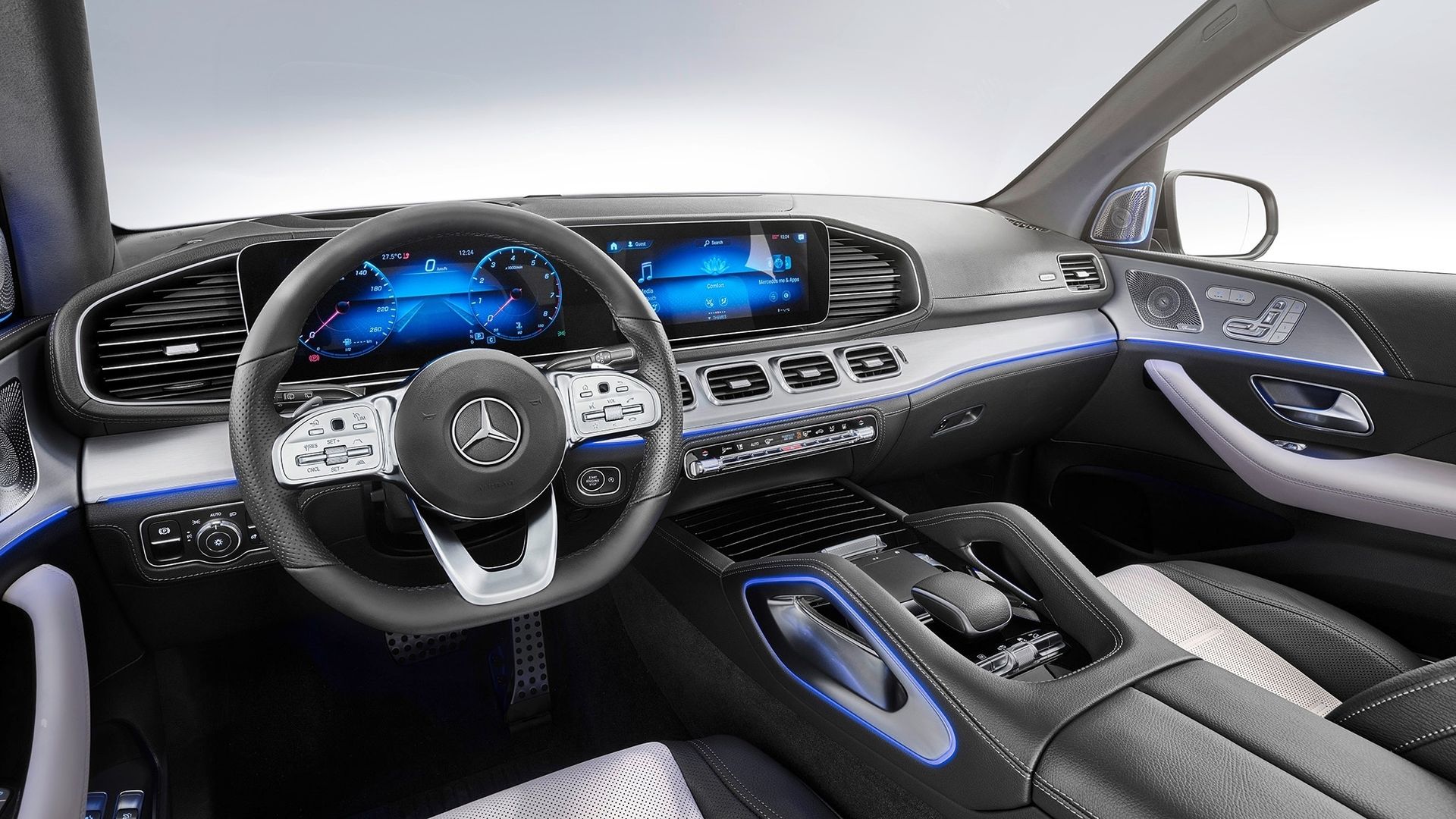 This image is the interior of the 2020 Mercedes, from the view of the driver's seat. The interior is largely black leather.