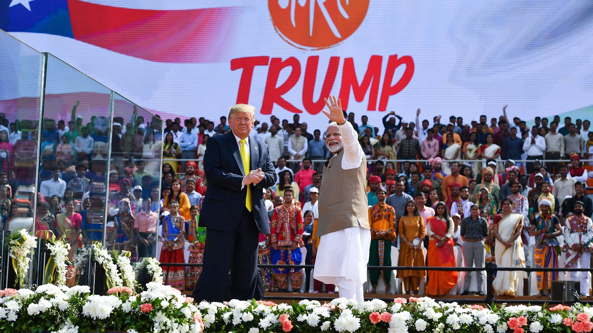  Donald Trump (L) looks on as India's Prime Minister Narendra Modi waves during 'Namaste Trump' rally
