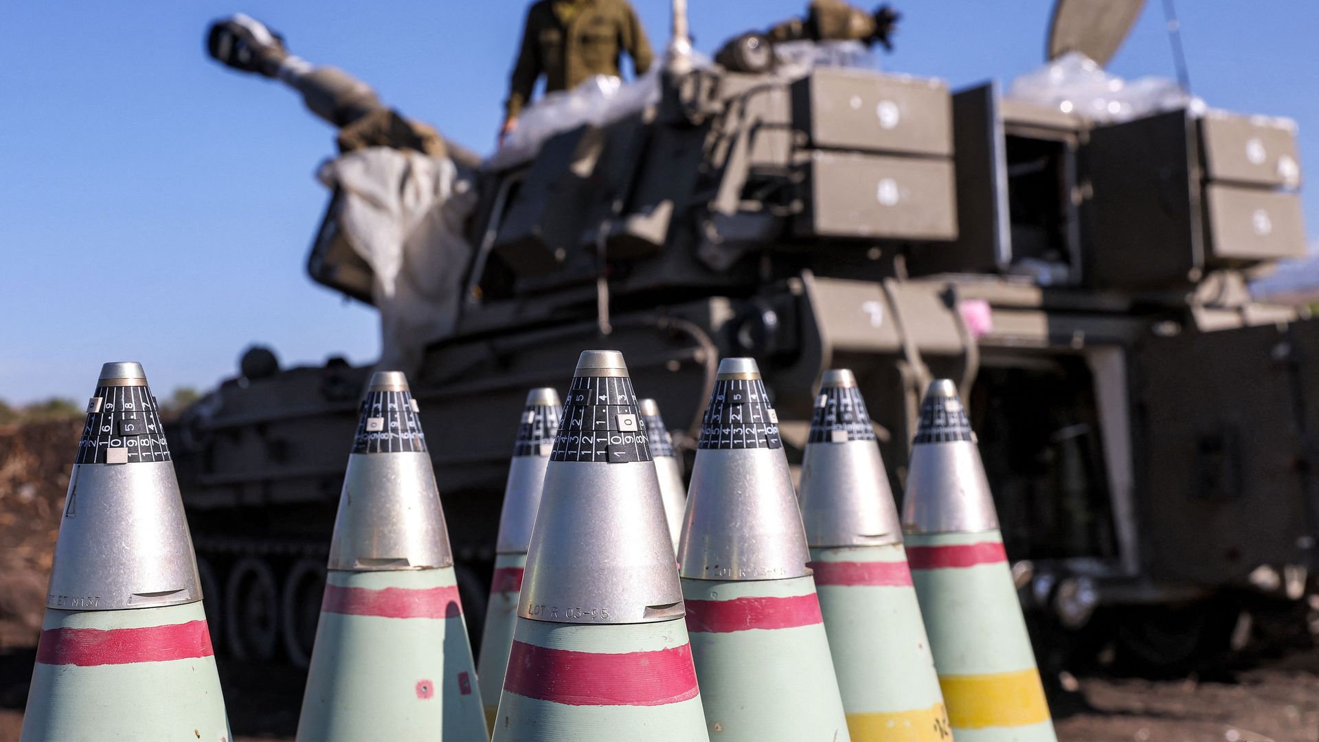 The tips of 155mm artillery shells are pictured near a self-propelled howitzer deployed at a position near the border with Lebanon in the upper Galilee region of northern Israel on October 18, 2023.