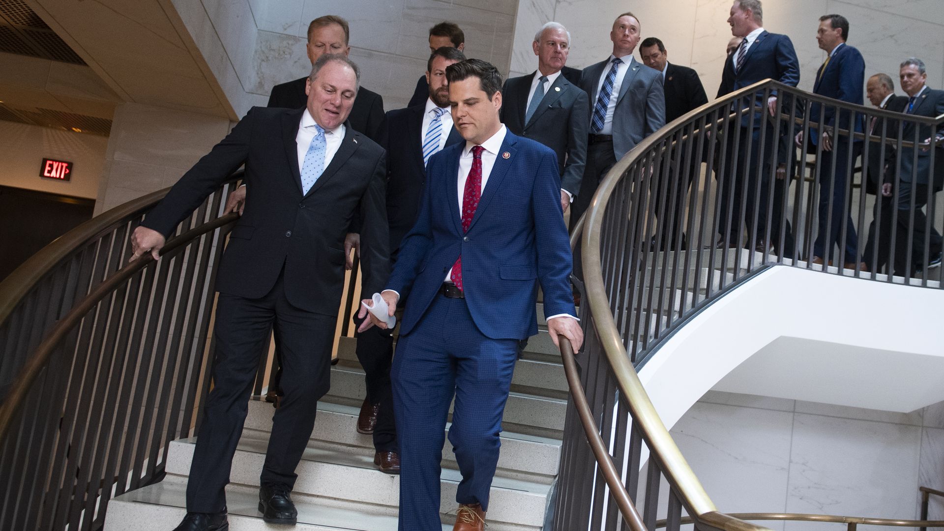 A picture of the lawmakers walking.