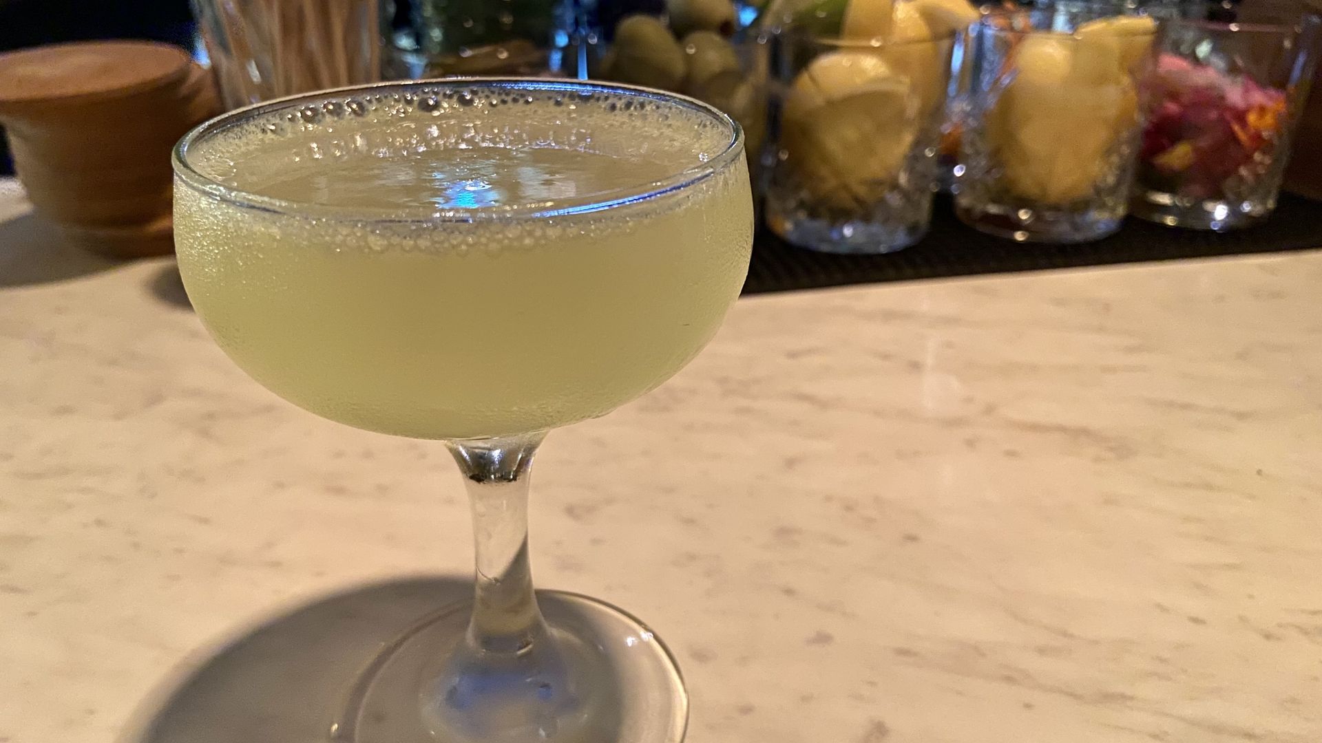 A photo of a slightly green cocktail