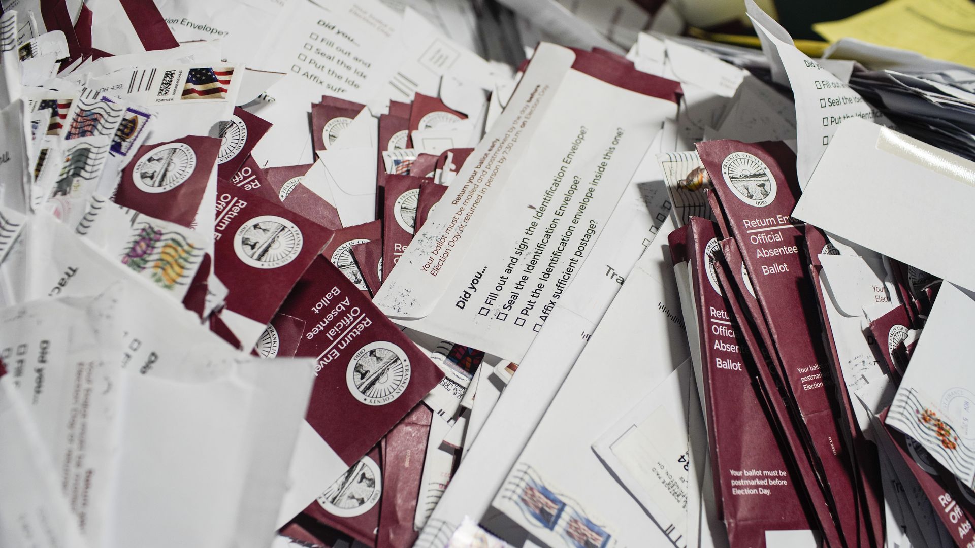 A stack of discarded absentee ballot envelopes.