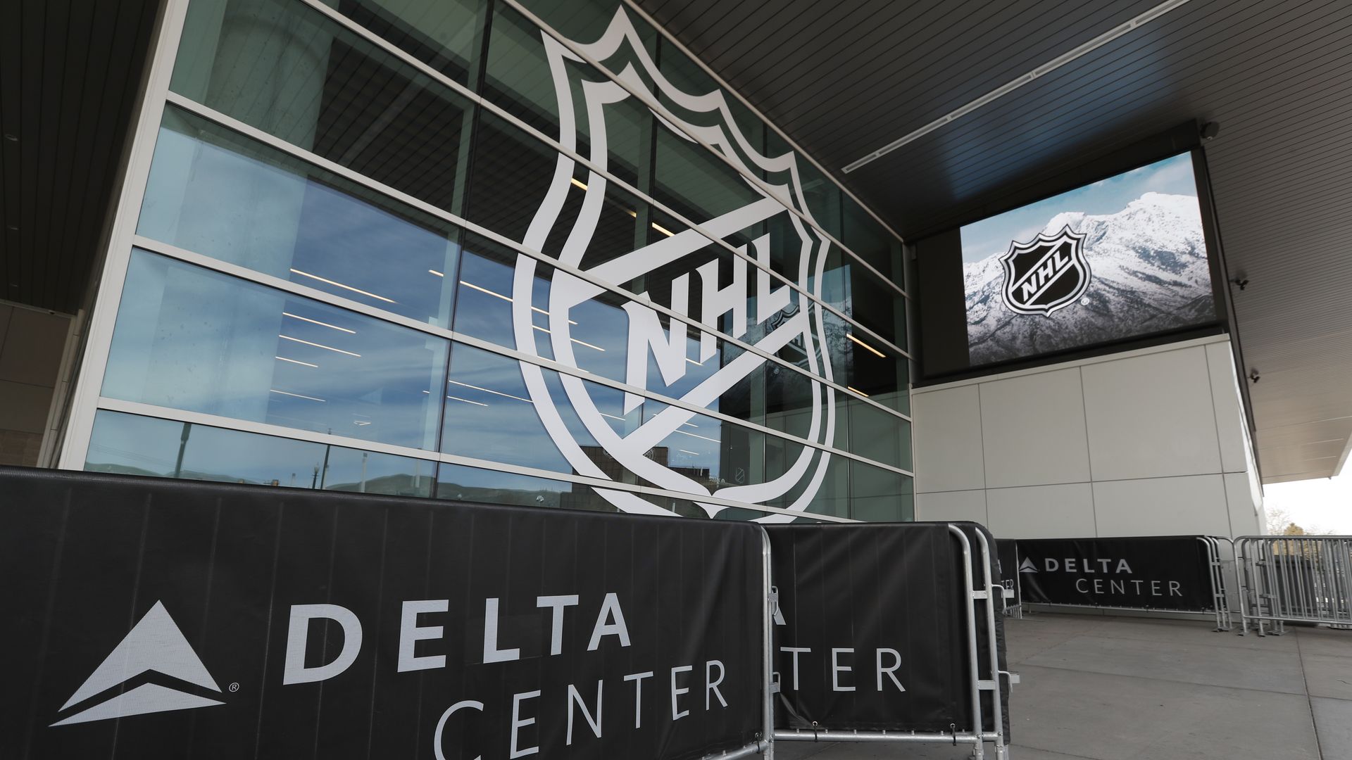 The NHL logo appears at the Delta Center.