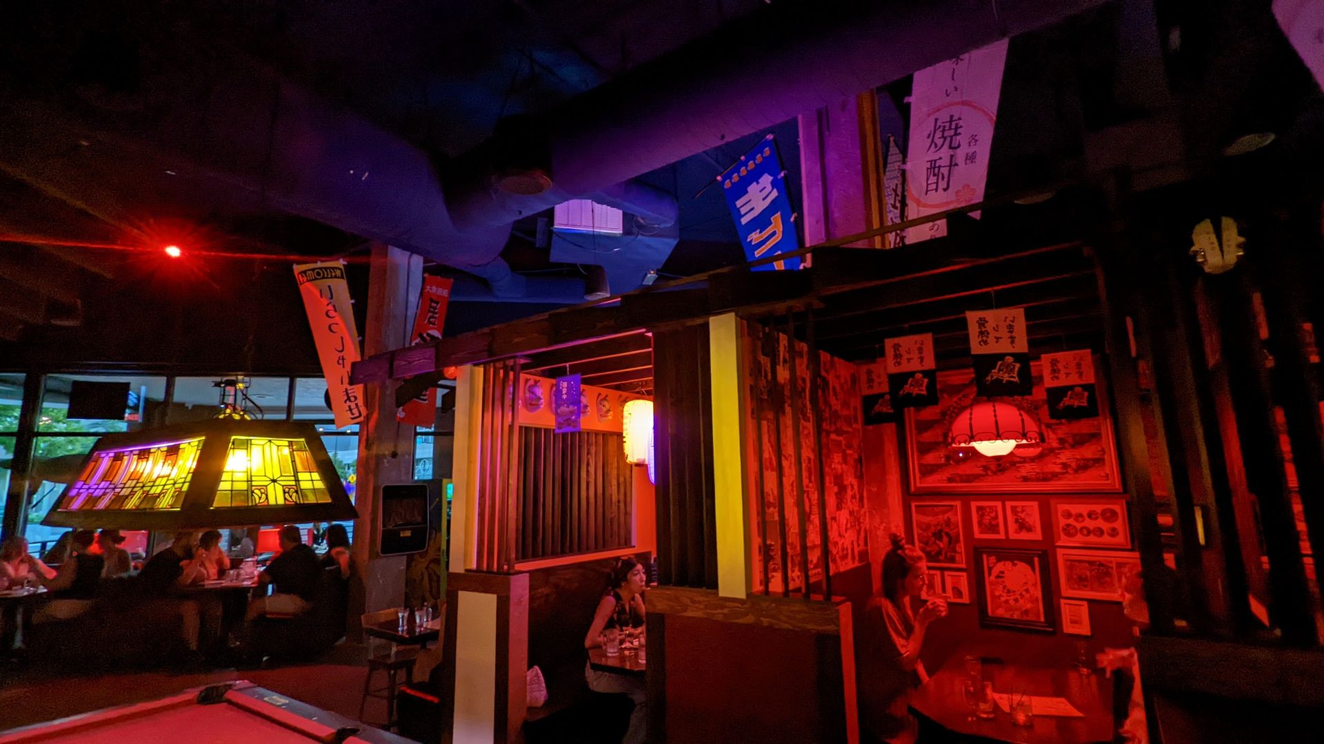 A Tokyo themed bar with individual booth "rooms." 