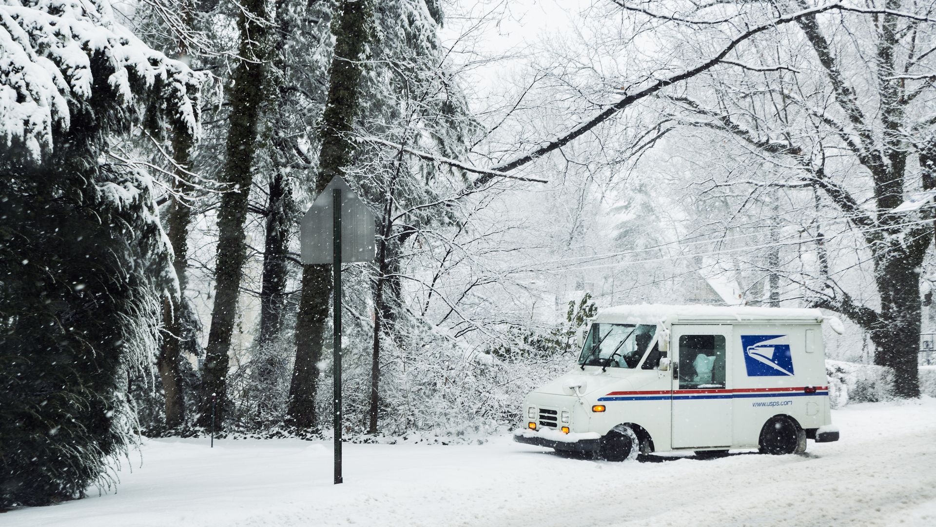 Mail delivery truck in the snow