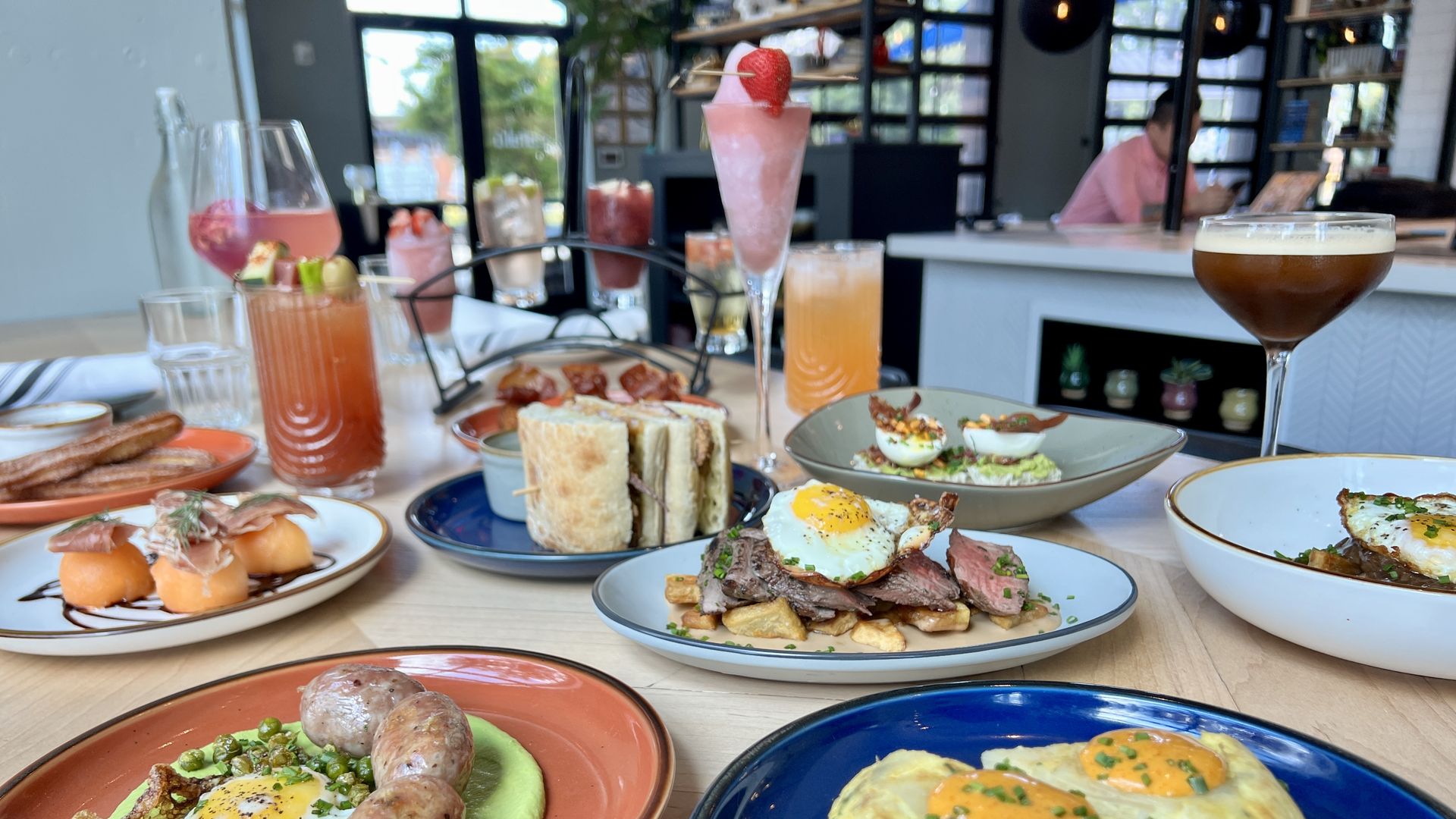 several brunch dishes and cocktails