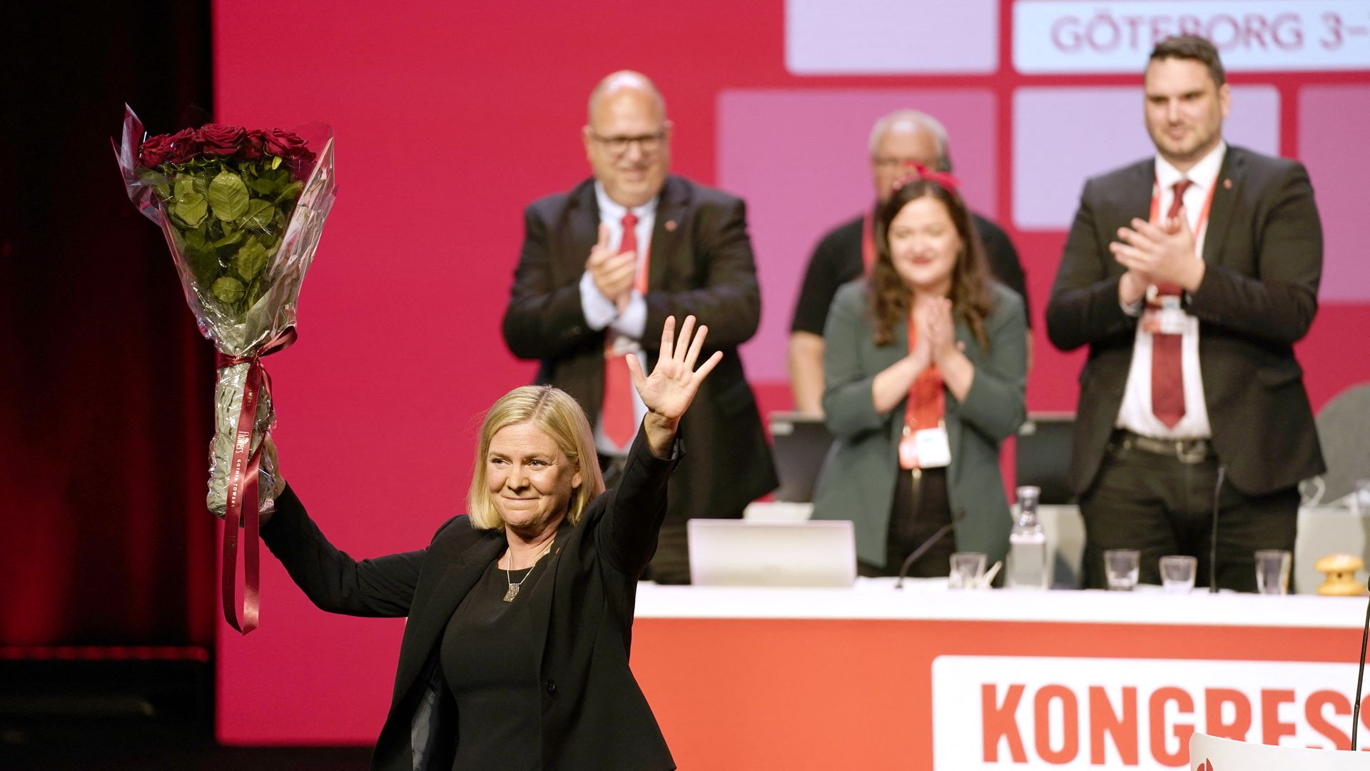 Magdalena Andersson raises a bouquet of red roses after being elected to party chair of Sweden's Social Democratic Party at the Social Democratic Party congress in Gothenburg, Sweden, on November 4,