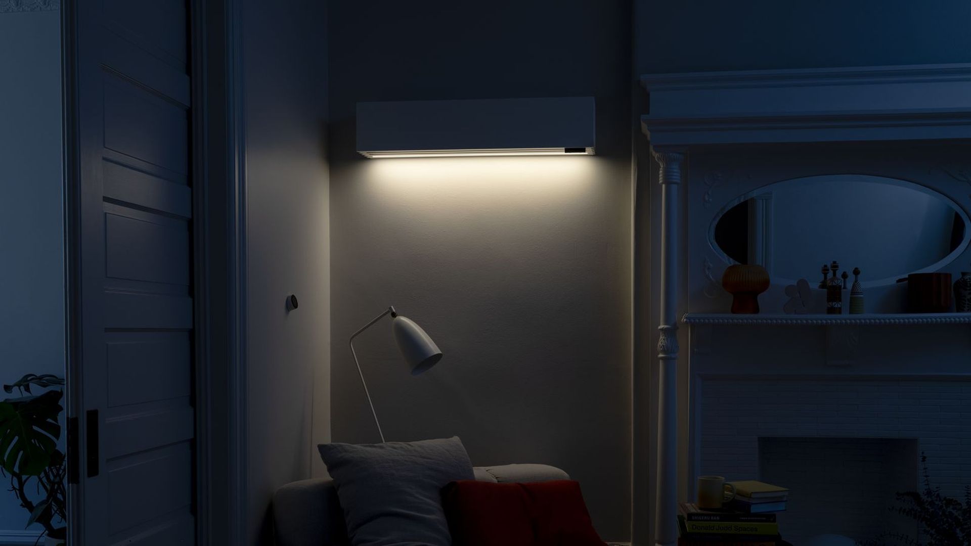 A Quilt heat pump mounted to a wall and lit up