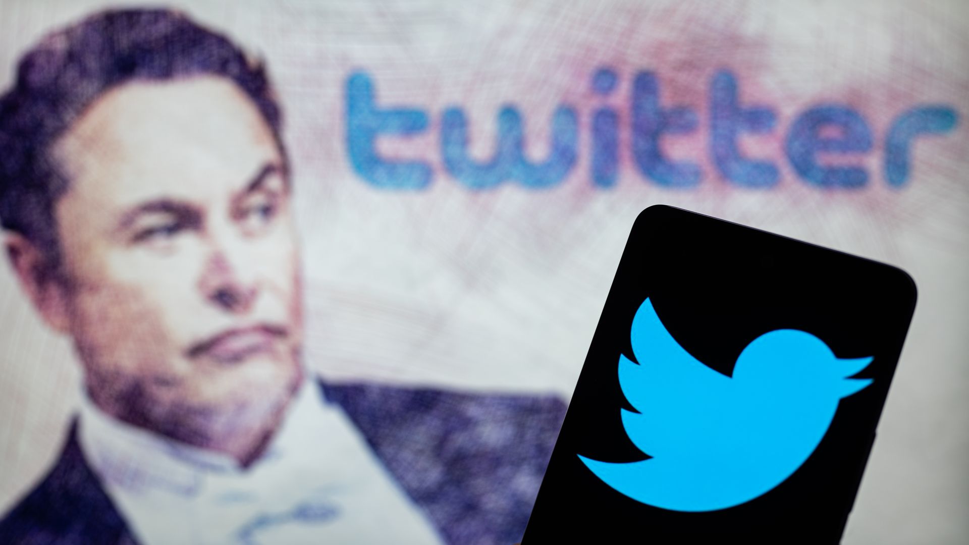 Elon Musk Twitter account seen on Mobile with Elon Musk in the background on screen, seen in this photo illustration. On 19 February 2023 in Brussels, Belgium.