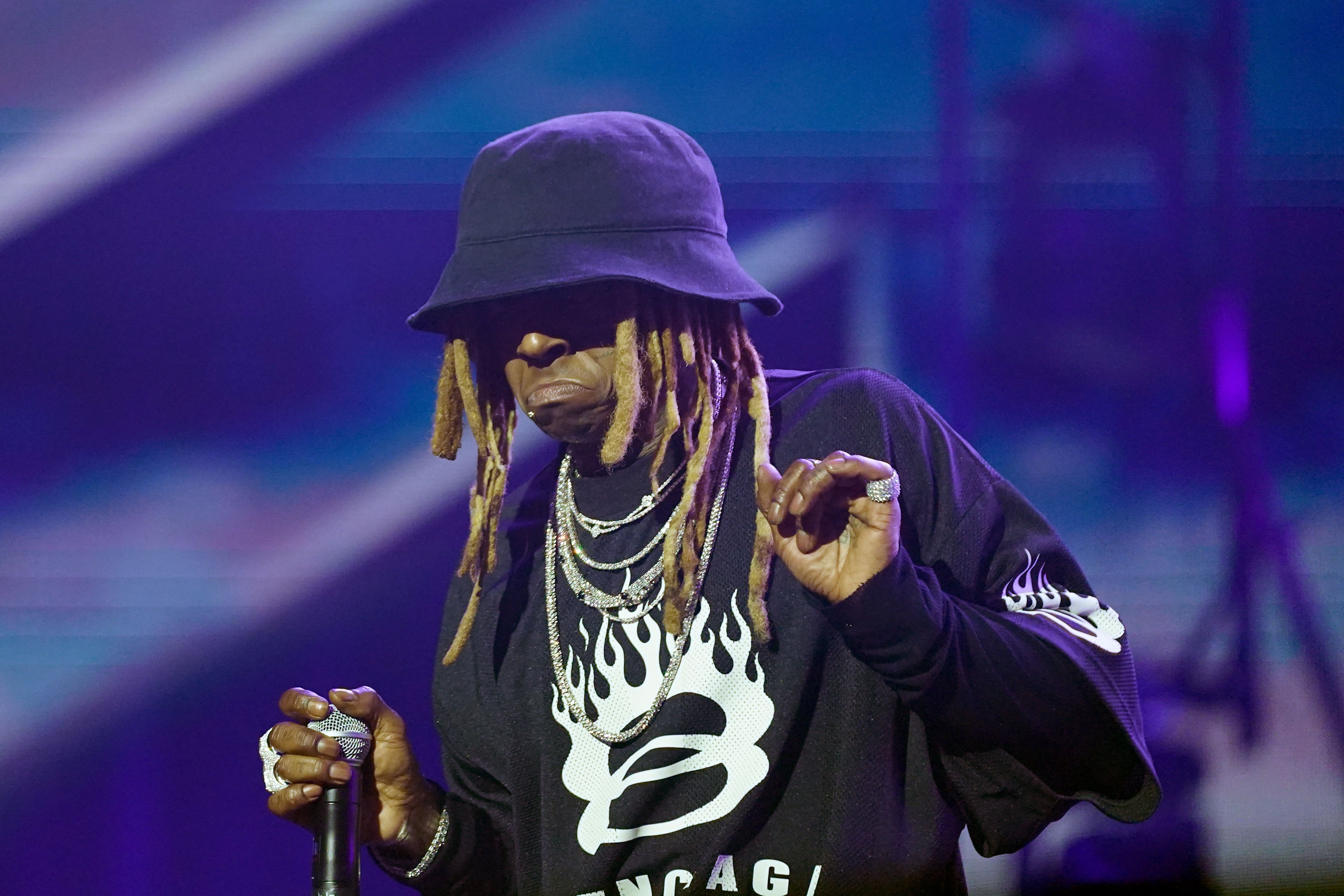 Photo shows Lil Wayne performing at Essence Fest.