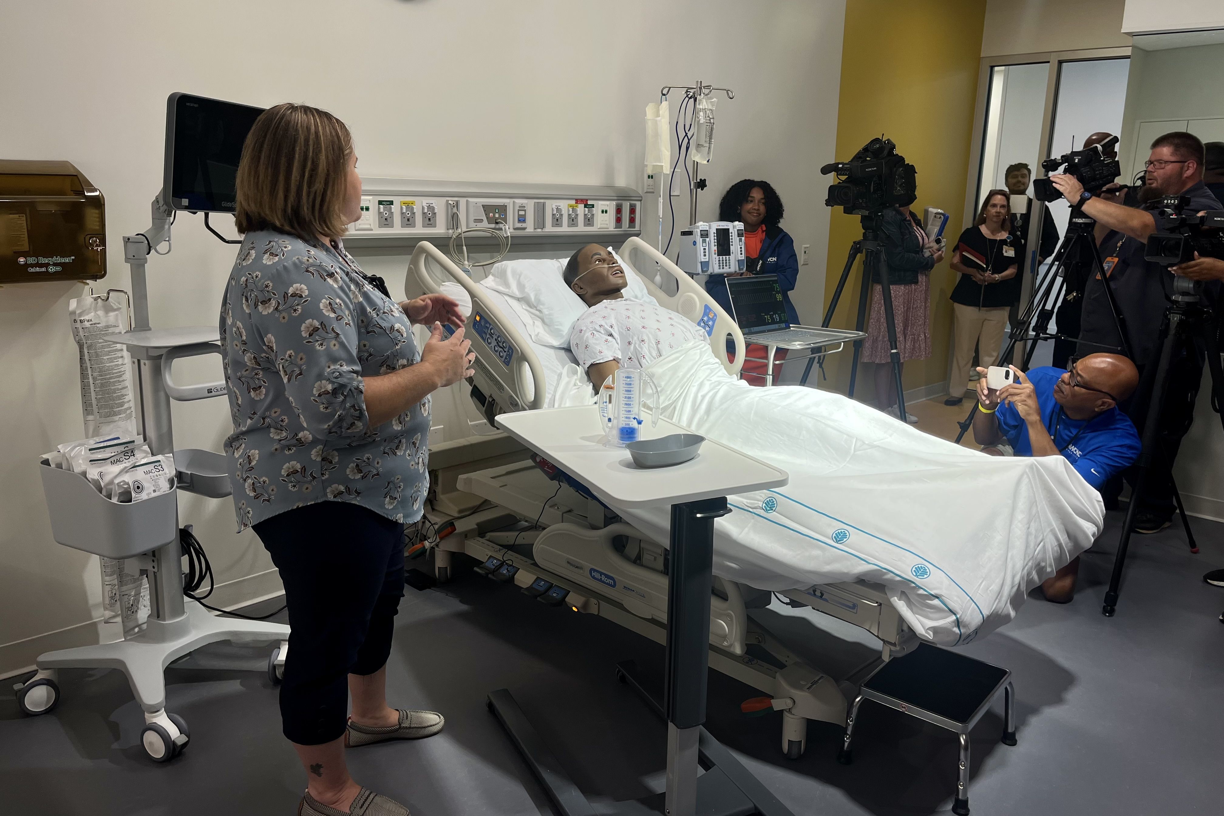 A mannequin in a hospital bed