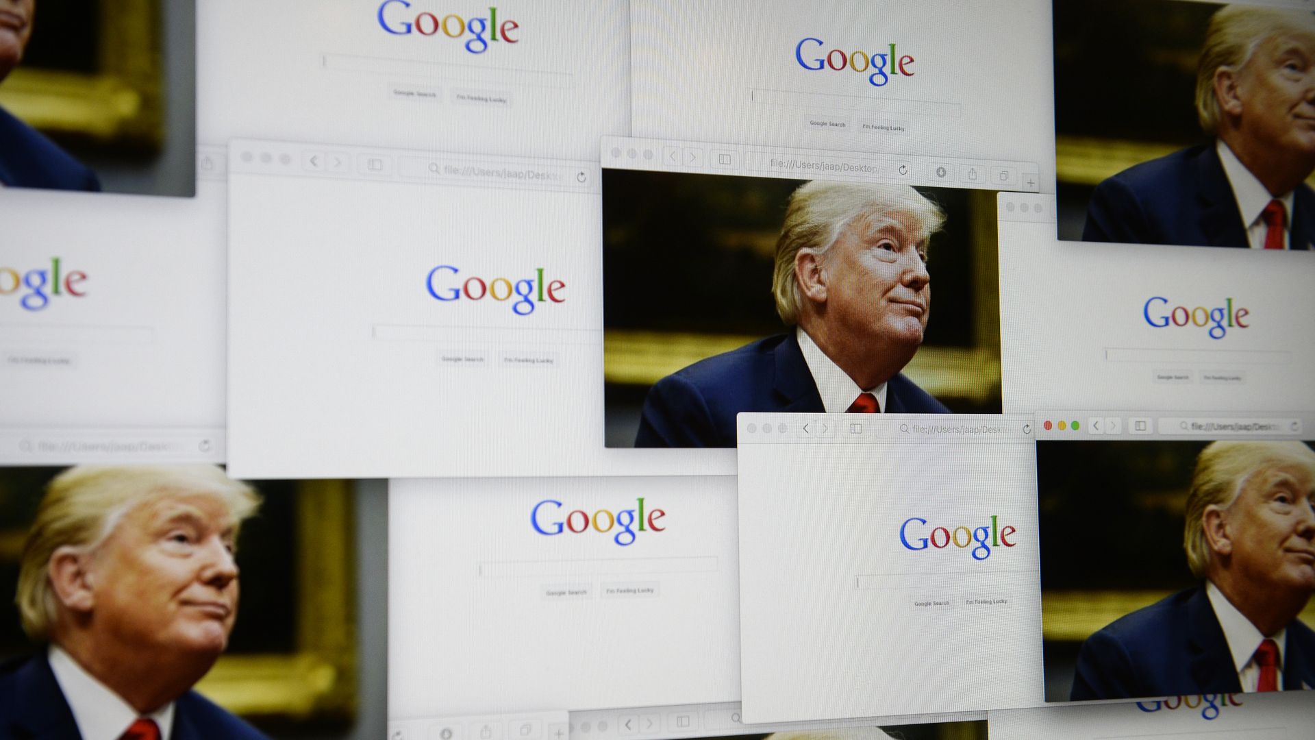 Google logos are seen in this photo illustration together with images of Donald Trump on September 5, 2018.