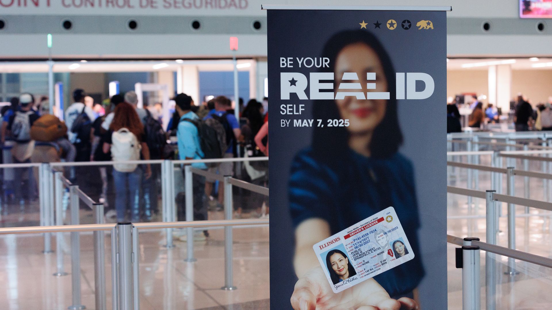 Airport poster saying "Be your REAL ID Self by May 7, 2025" 