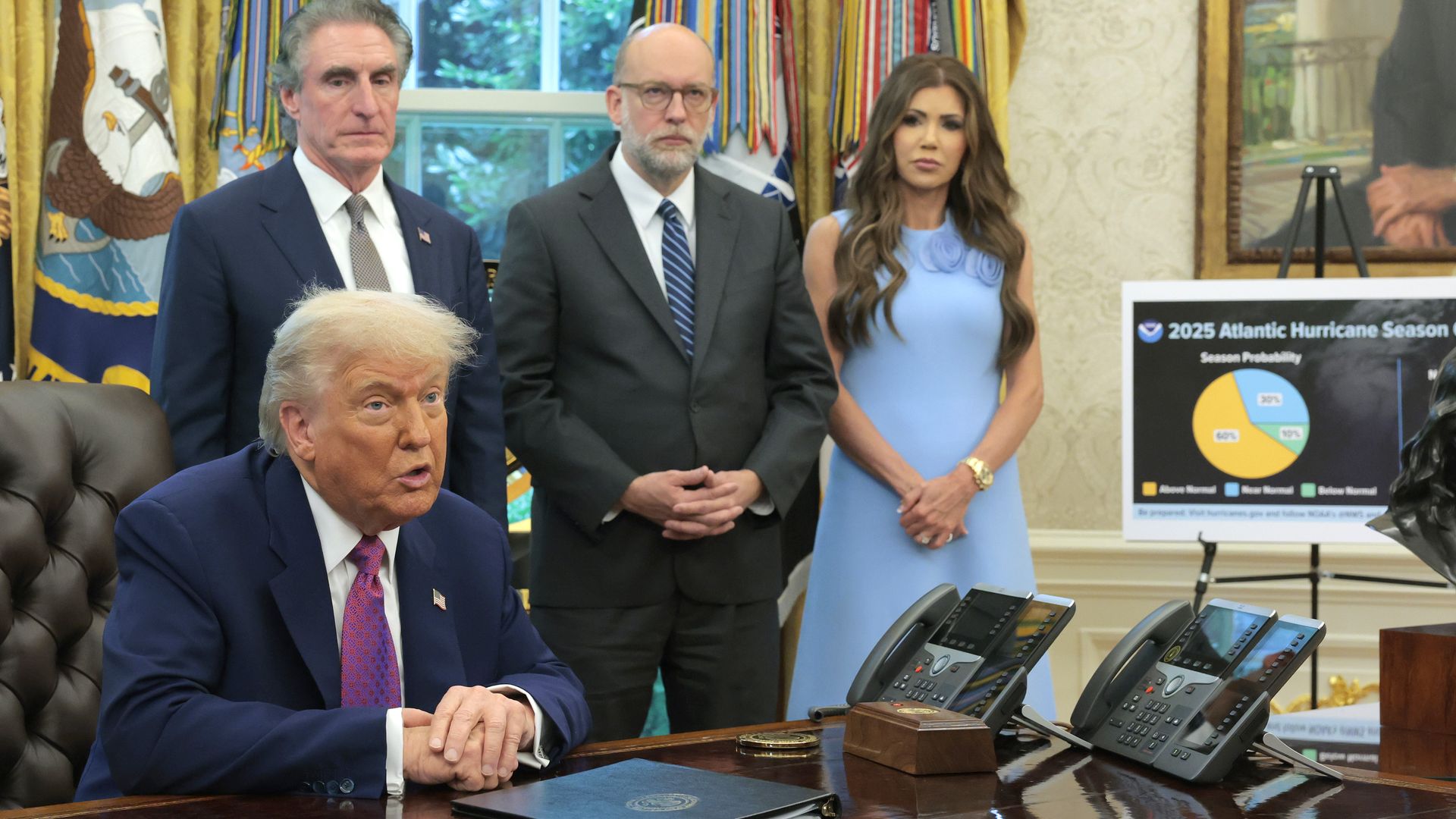 U.S. President Donald Trump, joined by Interior Secretary Doug Burgum, Director of the Office of Management and Budget Russell Vought and Secretary of Homeland Security Kristi Noem, delivers a statement on natural disaster preparedness in the Oval Office at the White House on June 10, 2025.