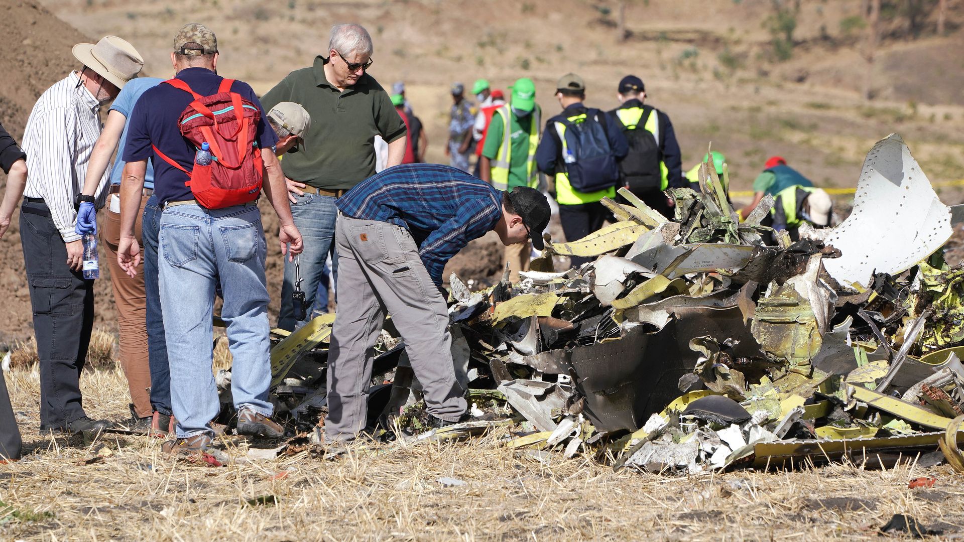 Investigators with the U.S. National Transportation and Safety Board (NTSB) look over debris at the crash site of Ethiopian Airlines Flight ET 302 on March 12, 2019 in Bishoftu, Ethiopia.