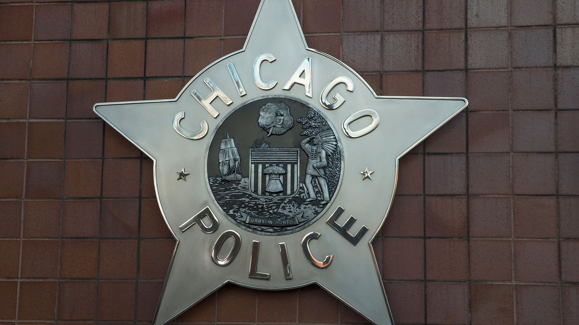 Photo of the Chicago police logo on the exterior of a building