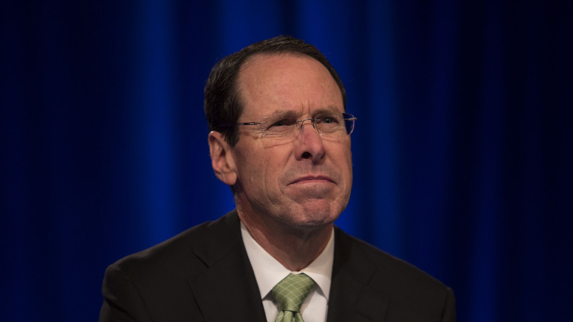 AT&T CEO Randall Stephenson grimaces