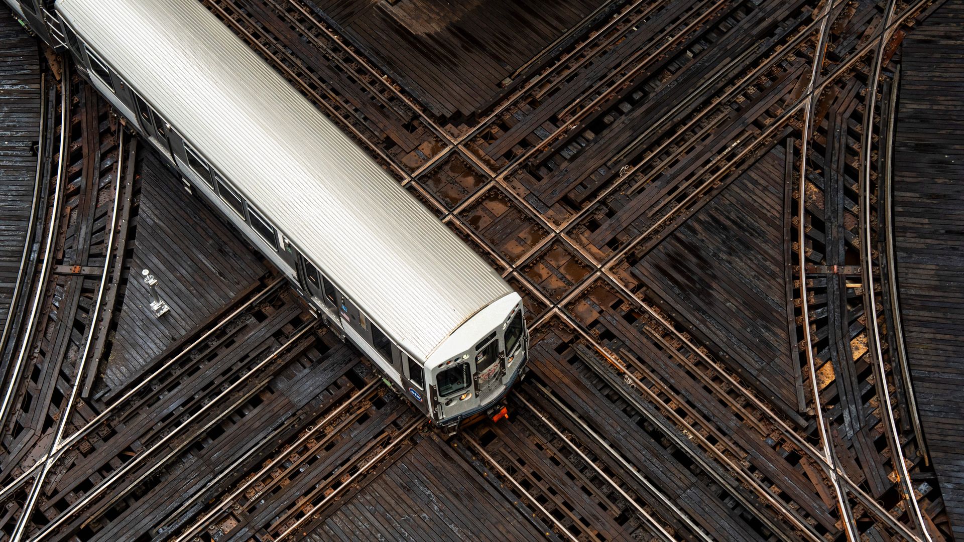 Aerial view of CTA train on tracks.