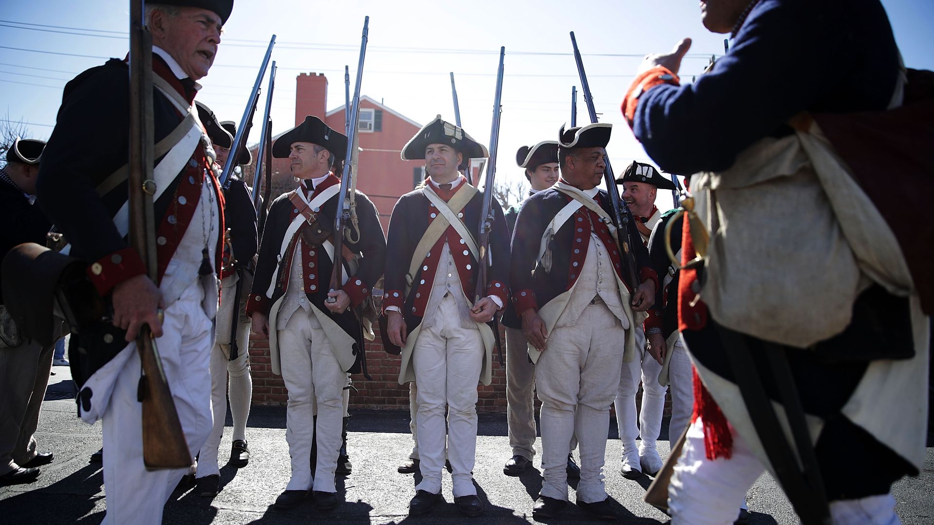 Members of the First Virginia Regiment, a Revolutionary War living history reenactment group, participate in the annual George Washington Birthday Parade February 20, 2017 in Old Town Alexandria, Virginia. 