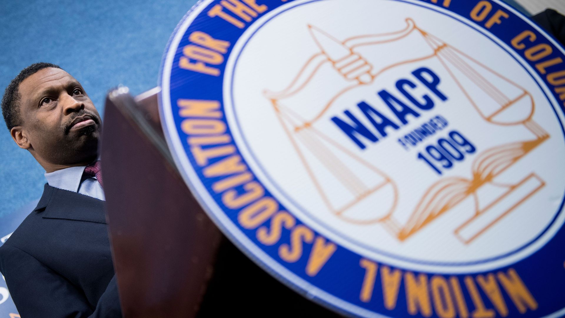 NAACP President derrick johnson at a podium