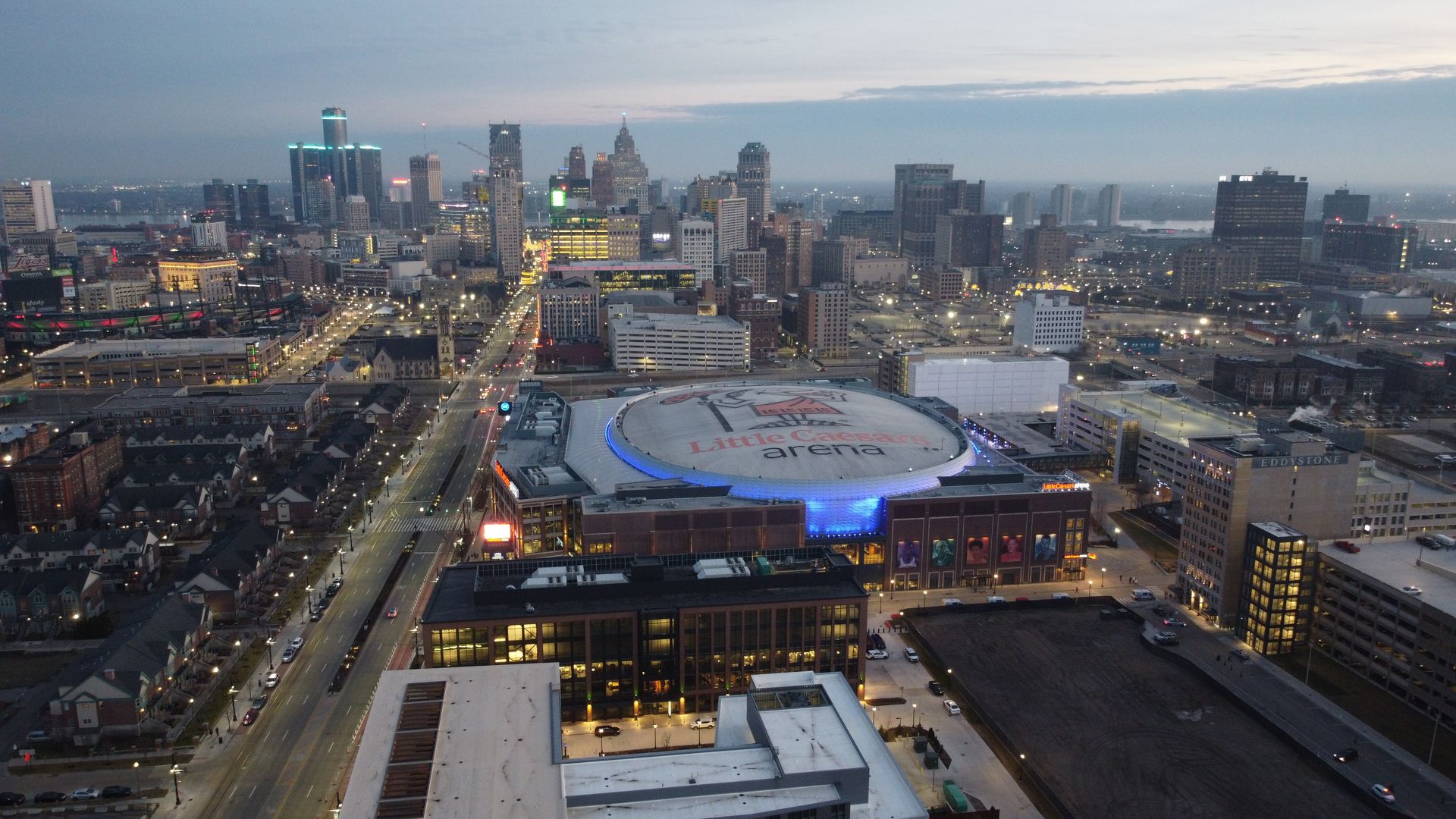 An overhead view of Little Caesars Arena and the Detroit skyline. 