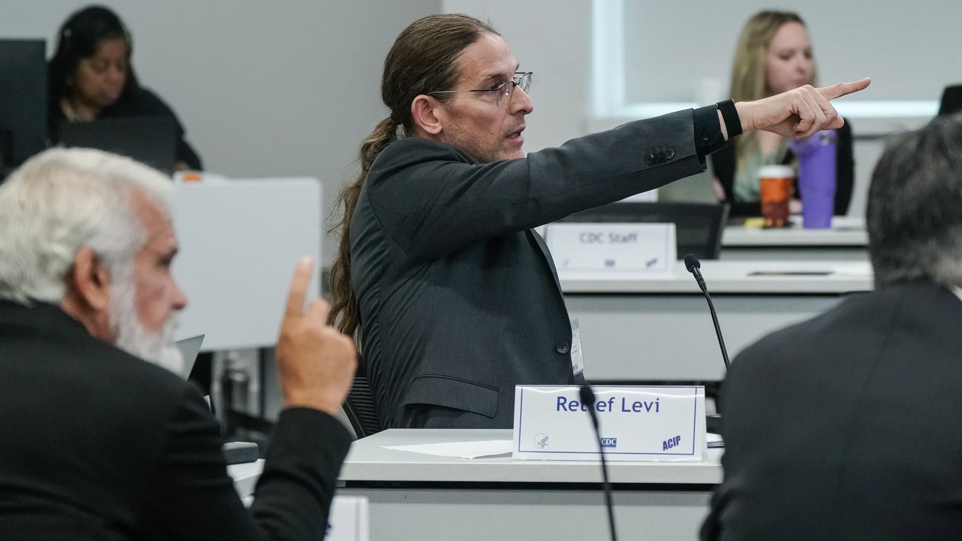 Retsef Levi points to a slide while speaking during a meeting of the CDC's Advisory Committee on Immunization Practices on September 18, 2025 in Atlanta, Georgia.