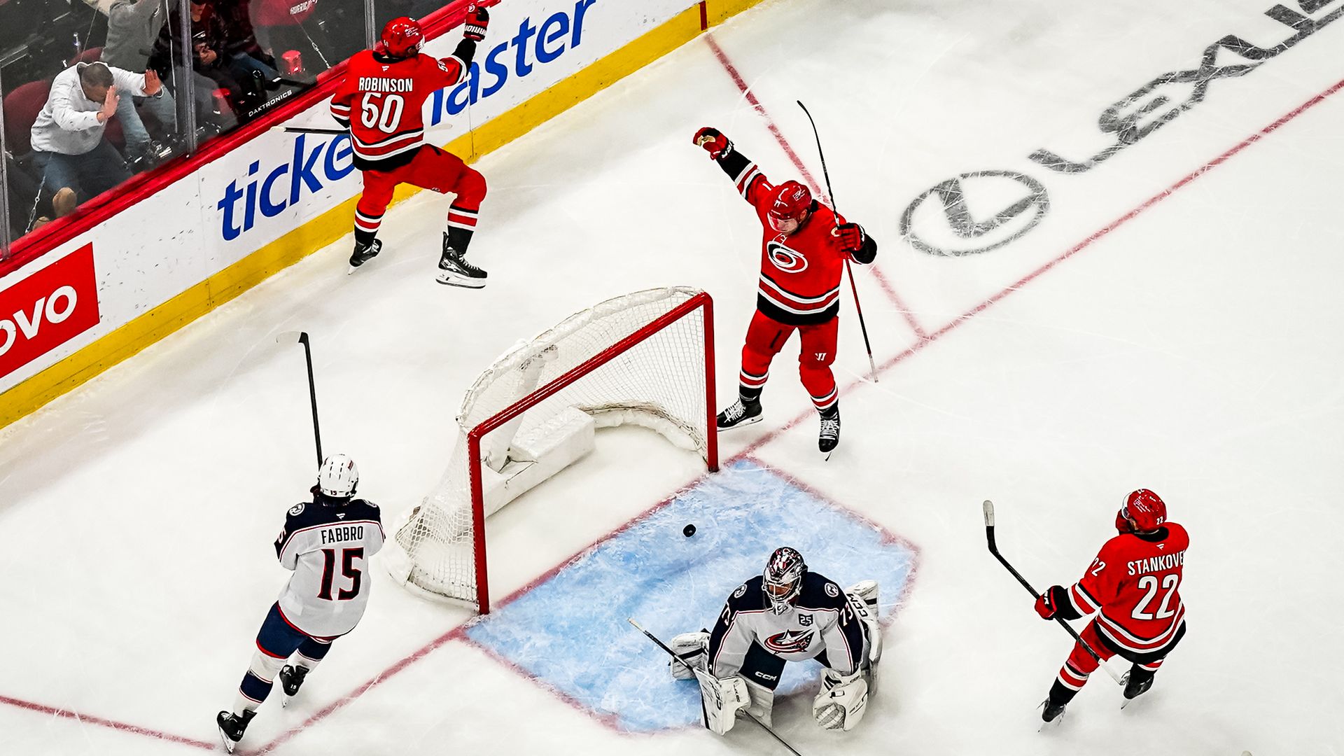 Carolina Hurricanes players celebrate a goal against the Columbus Blue Jackets