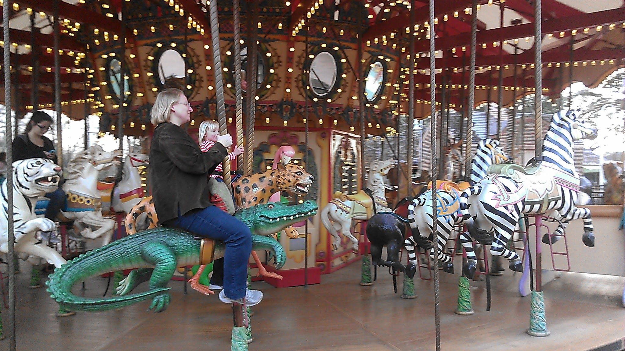 Photo shows a gator on a carousel.
