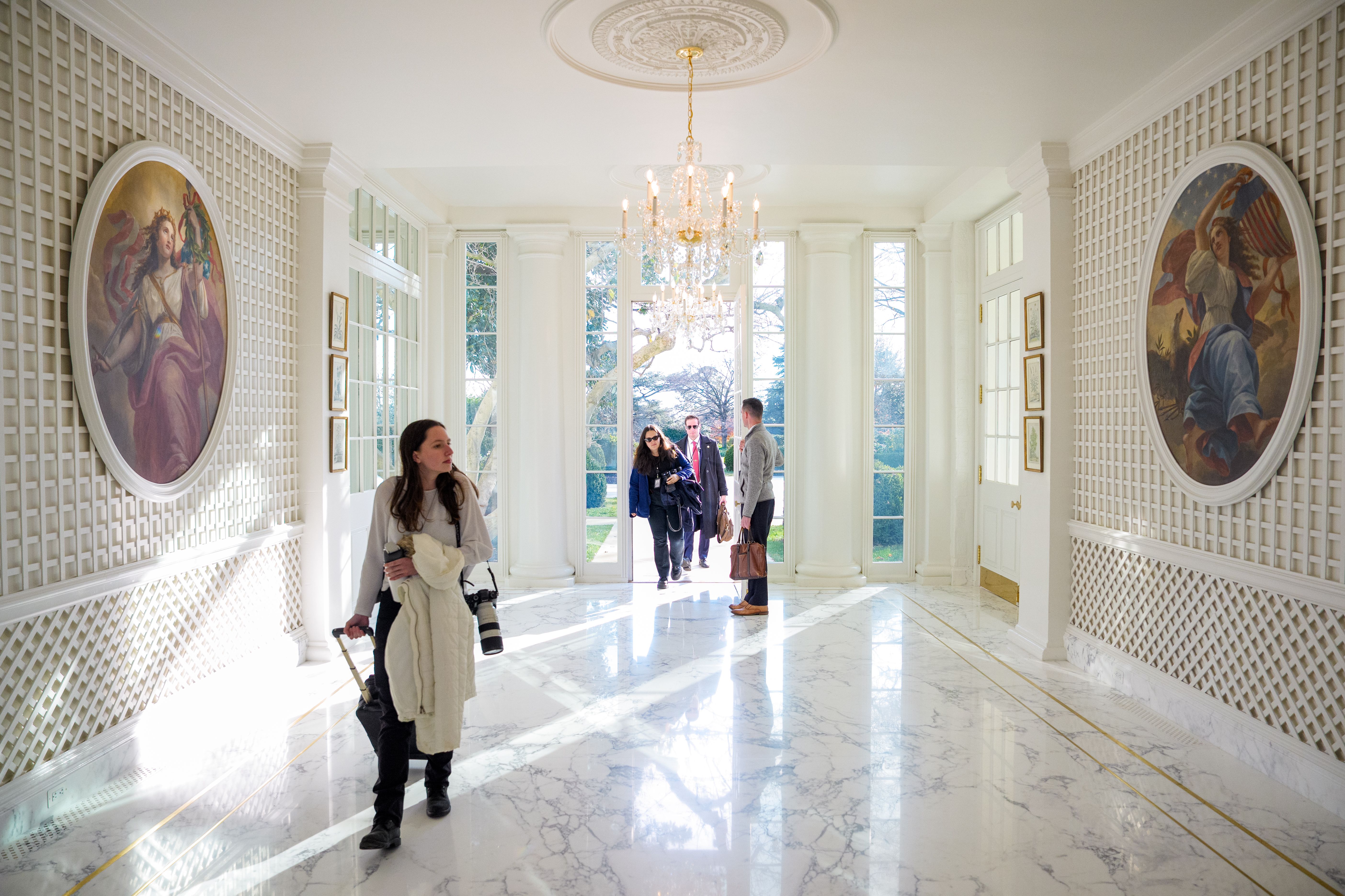 Interior view of the Palm Room in the White House, a corridor connecting the residence to the West Colonnade toward the West Wing.