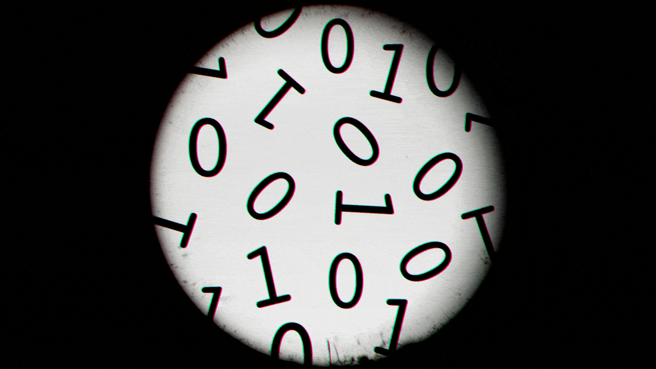 Animated illustration of a view through a microscope showing wiggling binary code.