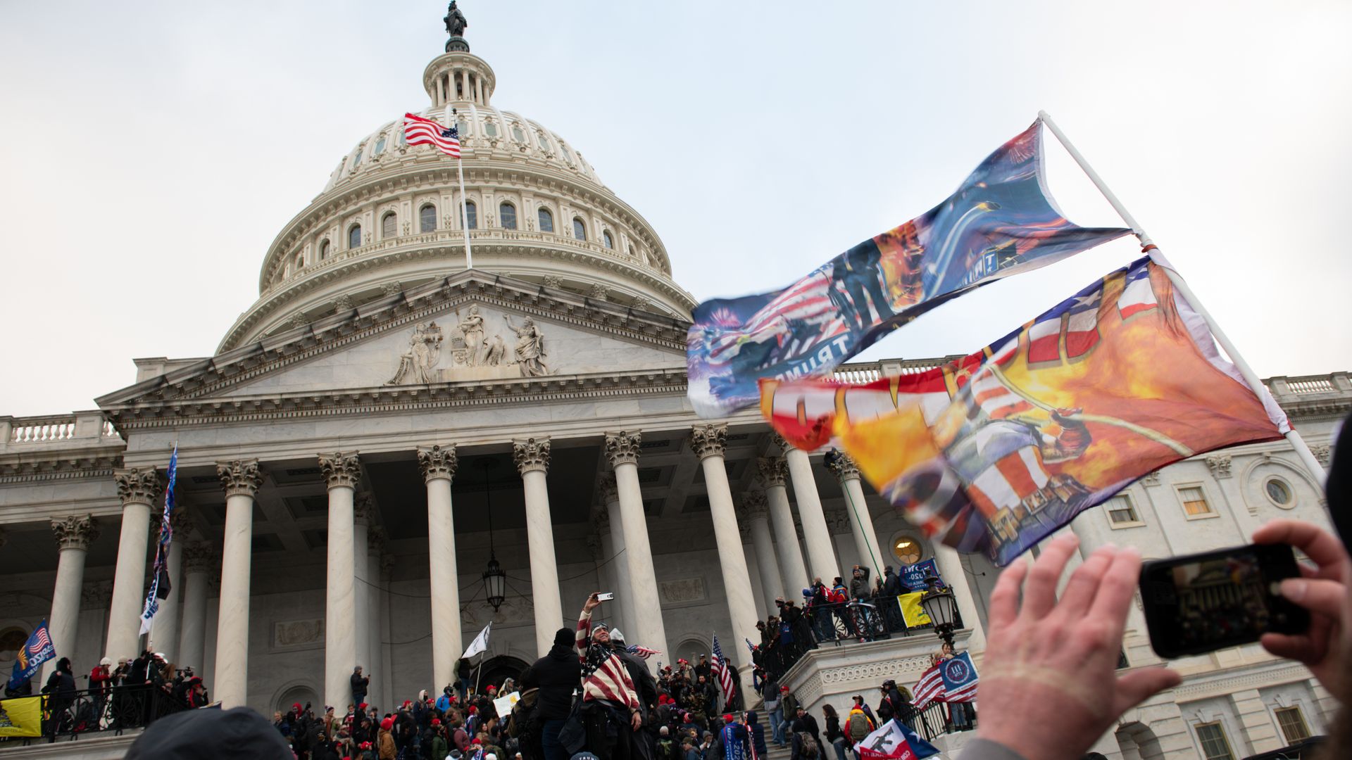 Demonstrators stands outside the U.S. Capitol on Jan. 6.