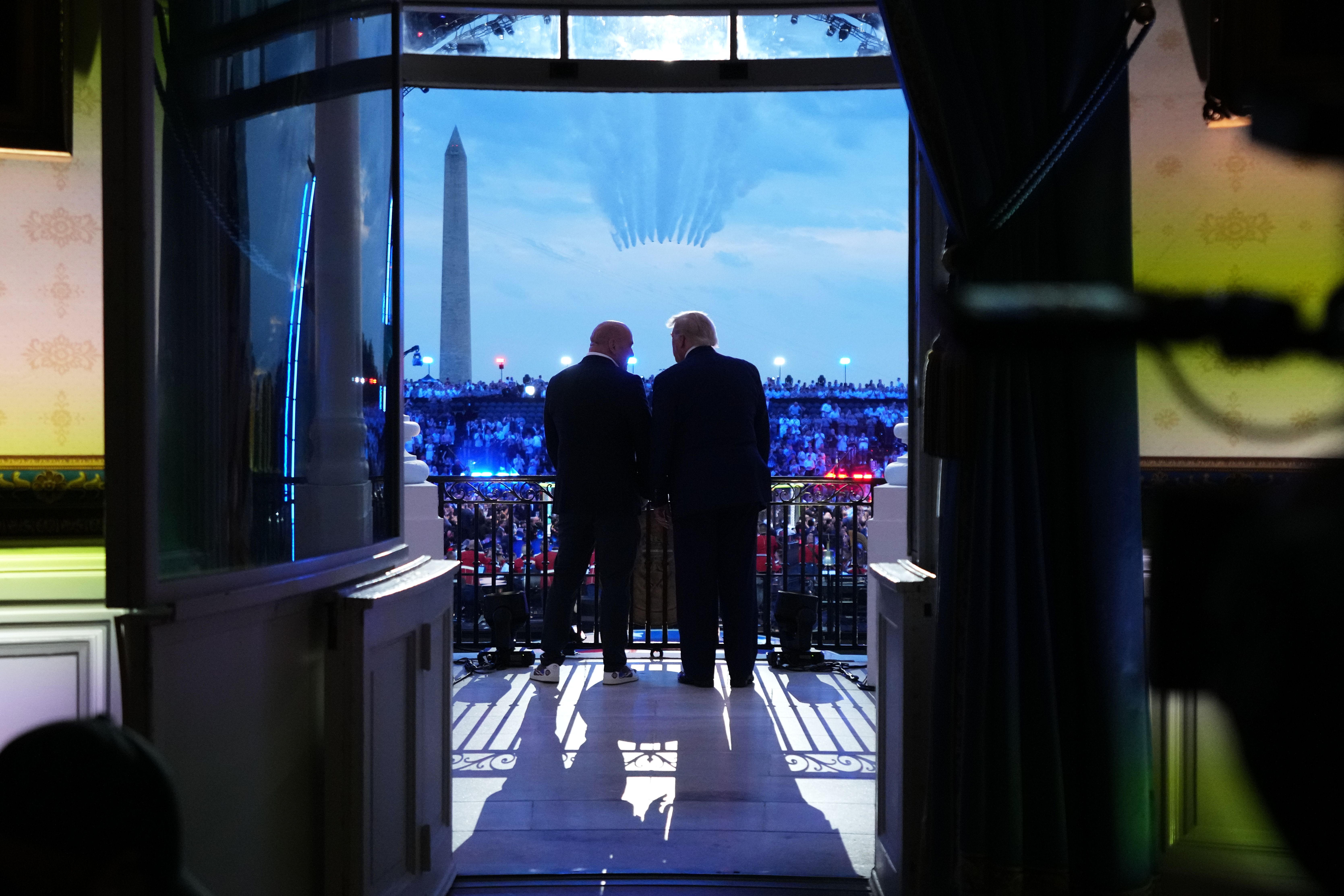 President Donald Trump and UFC CEO Dana White watch the U.S. Air Force Thunderbirds and U.S. Navy Blue Angels perform a flyover before the UFC Freedom 250 fights on the South Lawn yesterday.
