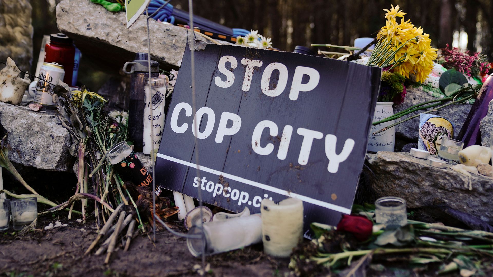 "Stop Cop City" sign placed at memorial to Manuel "Tortuguita" Teran at the site of the Atlanta public safety training center