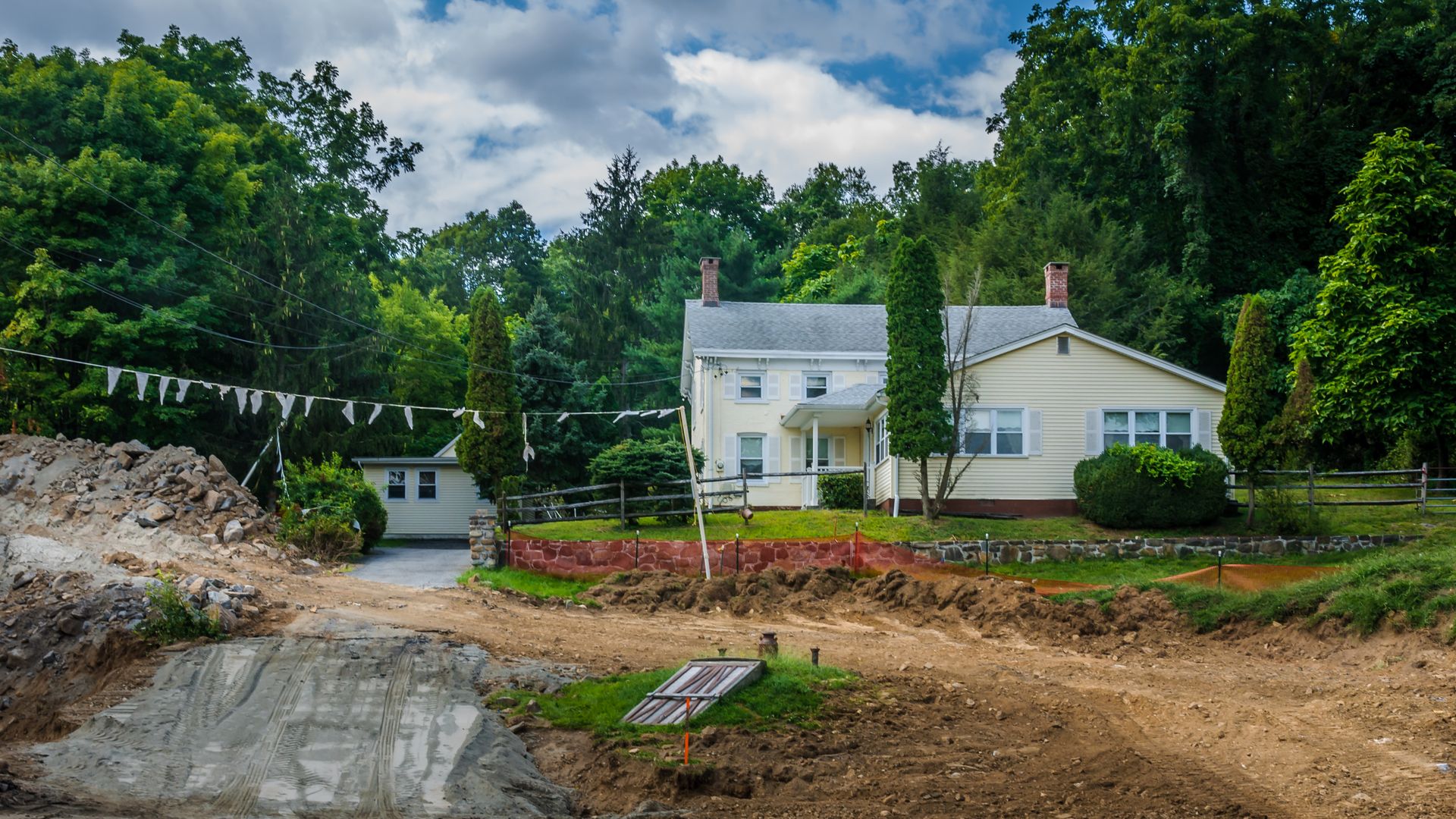 pipeline construction site near a suburban home