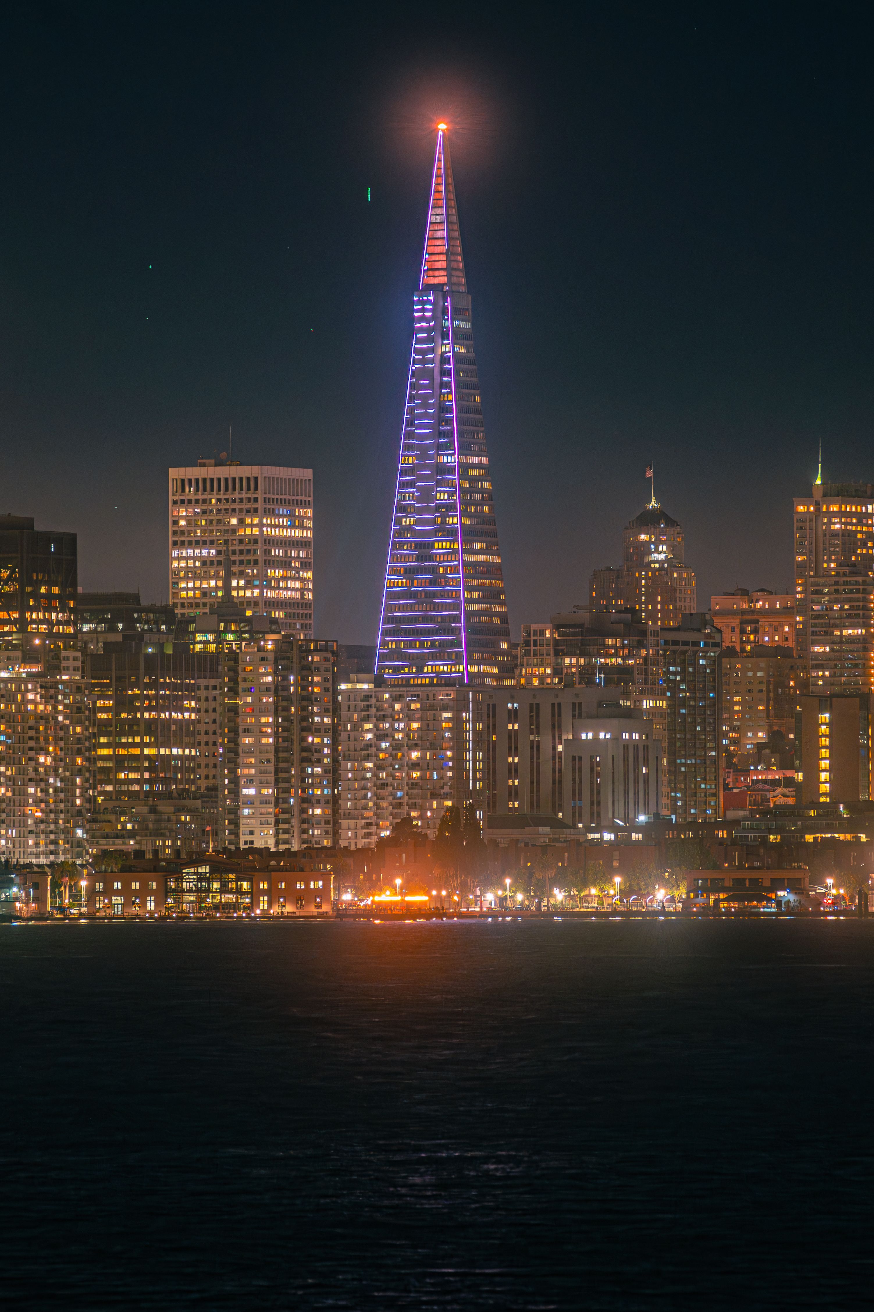 Photo of the Transamerica Pyramid lit up in blue and pink