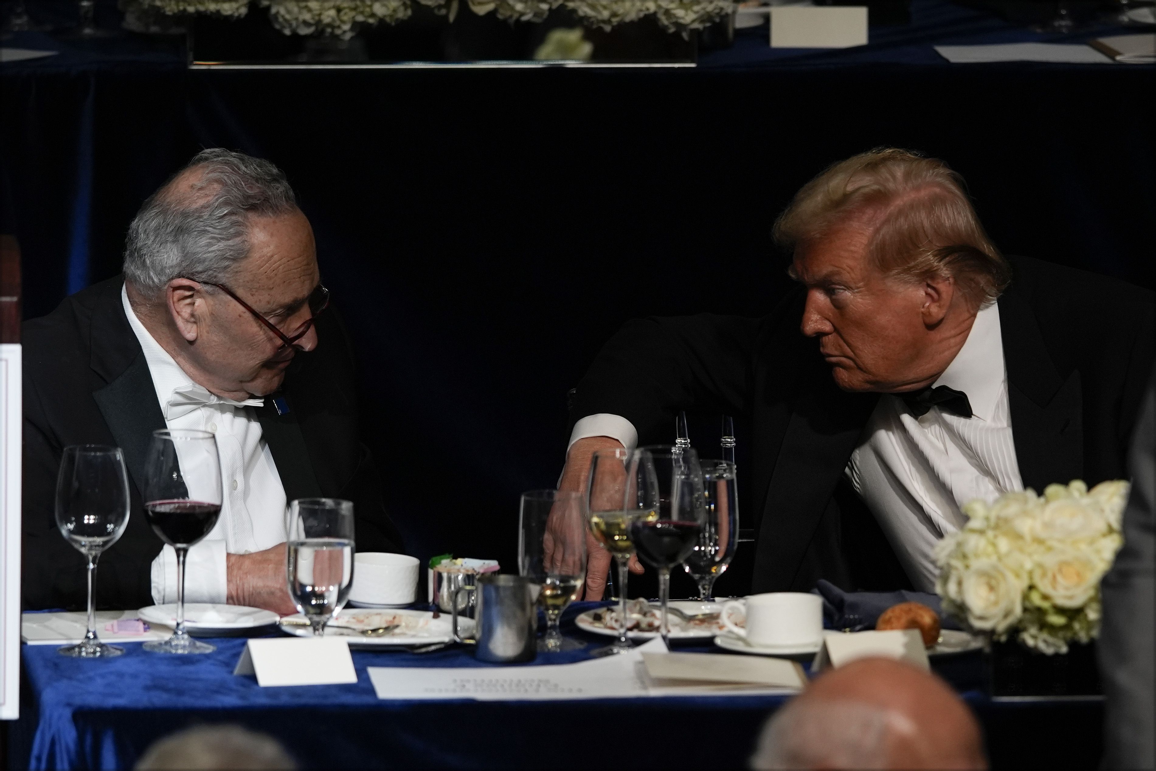 Republican presidential nominee former President Donald Trump talks with Senate Majority Leader Chuck Schumer of N.Y., at the 79th annual Alfred E. Smith Memorial Foundation Dinner, Thursday, Oct. 17, 2024, in New York. (AP Photo/Julia Demaree Nikhinson) 