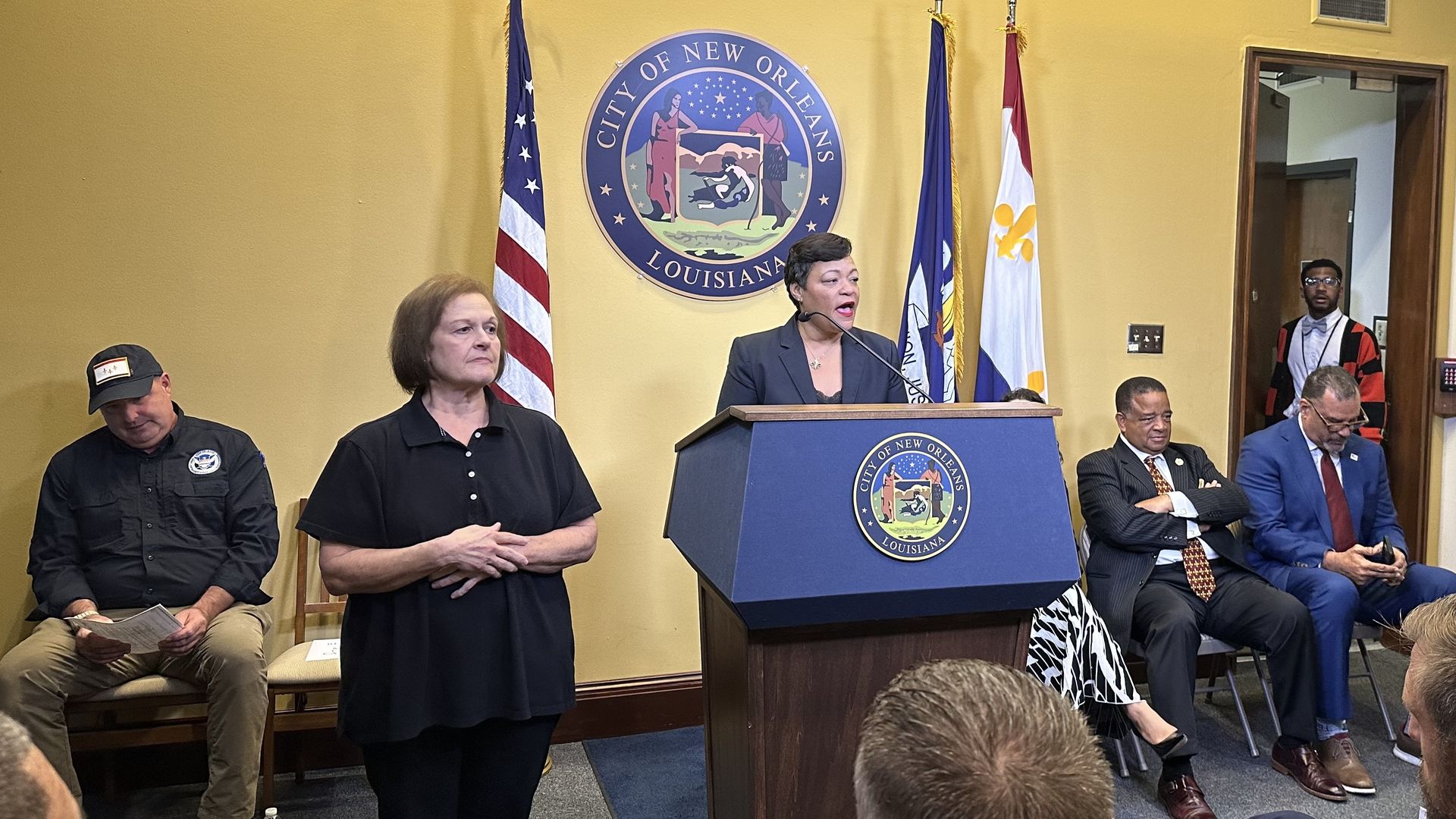 Mayor LaToya Cantrell speaks at a podium with New Orleans' seal.