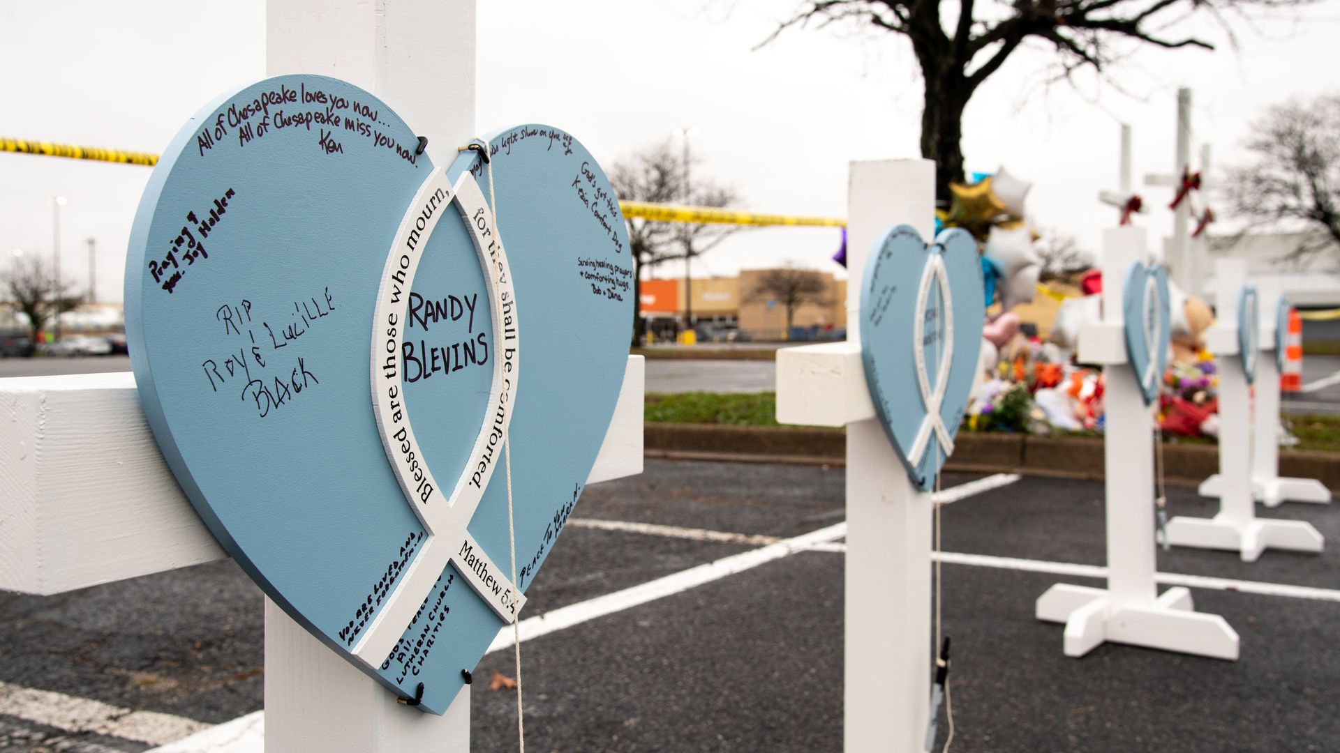 Crosses, placed for the victims of the Walmart shooting, are placed in the parking lot of the Walmart on November 25, 2022.