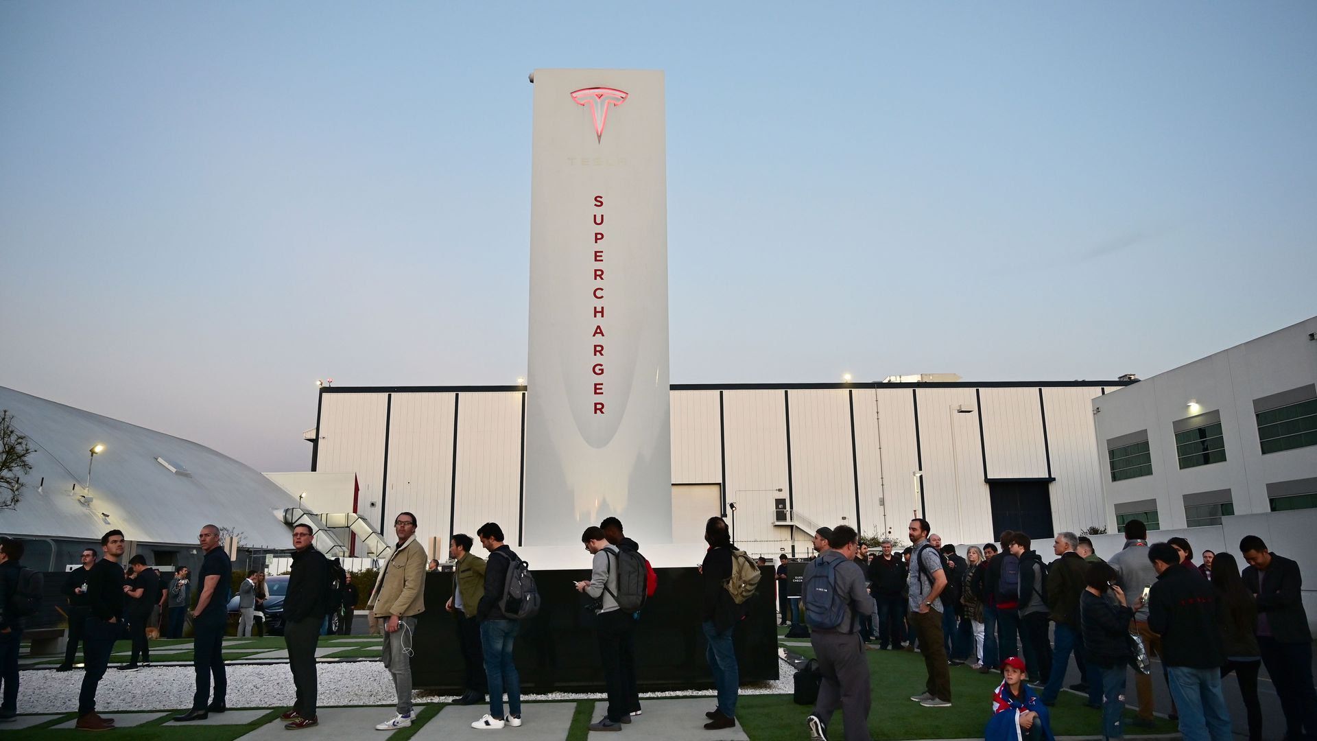 People waiting to see the unveiling of the new Tesla Model Y at the Tesla Design Center in California on March 14, 2019
