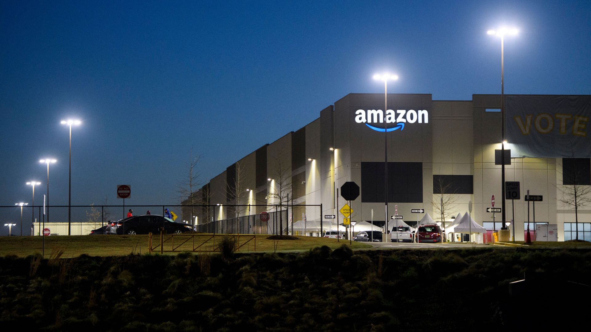 The Amazon.com, Inc. BHM1 fulfillment center is seen before sunrise on March 29, 2021 in Bessemer, Alabama