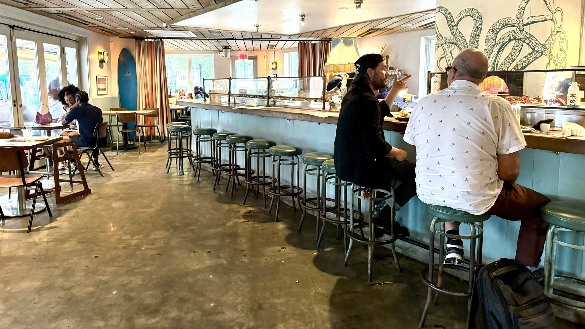 a view of the bar at the optimist restaurant